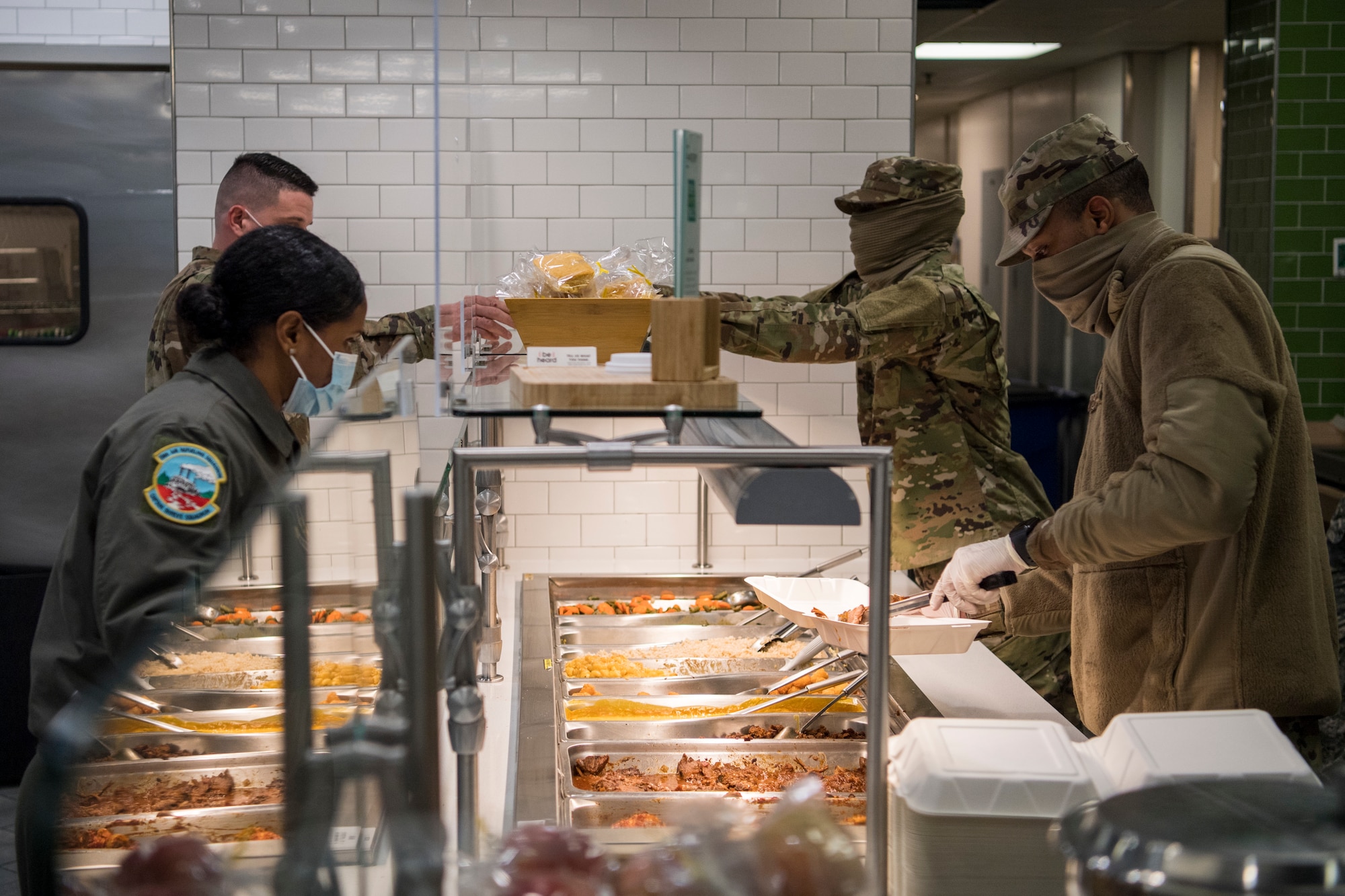Reserve Citizen Airmen with the 514th Force Support Squadron, 514th Air Mobility Wing, serve food at Halvorsen Hall Dining Facility, Joint Base McGuire-Dix-Lakehurst, N.J., on Dec. 5, 2020. During a period of rising COVID-19 cases across the country, members of the 514 FSS continue to provide food to Airmen so that theyReserve Citizen Airmen with the 514th Force Support Squadron, 514th Air Mobility Wing, serve food at Halvorsen Hall Dining Facility, Joint Base McGuire-Dix-Lakehurst, N.J., on Dec. 5, 2020. During a period of rising COVID-19 cases across the country, members of the 514 FSS continue to provide food to Airmen so that they can accomplish the Air Force Reserve mission. can accomplish the Air Force Reserve mission.