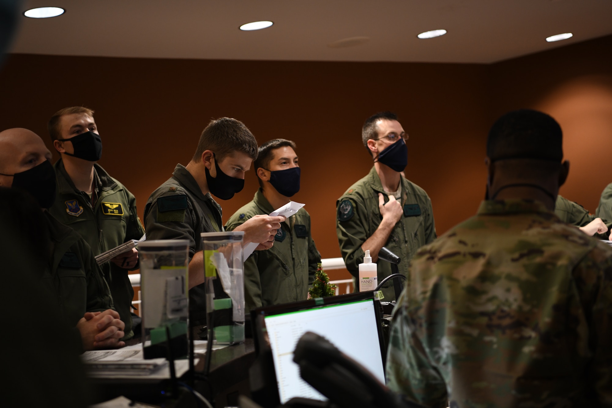 Aviators assigned to the 37th Expeditionary Bomb Squadron attend a step briefing prior to a deployment from Ellsworth Air Force Base, S.D., Dec. 3, 2020. Approximately 200 Airmen and several B-1B Lancers deployed to Andersen AFB, Guam, as part of U.S. Strategic Command’s support to the National Defense Strategy objectives of strategic predictability and operational unpredictability by using a mix of different aircraft to and from various U.S. bases and other departure and arrival points, to include Guam. (U.S. Air Force photo by Staff Sgt. Nicolas Z. Erwin)