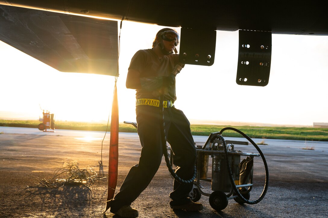 Airmen deployed for Bomber Task Force operations conduct a post-flight inspection on a U.S. Air Force B-1B Lancer at Andersen Air Force Base, Guam, Dec. 5, 2020. More than 150 Airmen and four B-1B Lancers assigned to the 37th Expeditionary Bomb Squadron  Ellsworth AFB, S.D., deployed to the Pacific in support of BTF dynamic force employment. This empowers a small but agile footprint of maintenance personnel to generate airpower at locations across the globe. (U.S. Air Force photo by Senior Airman Tristan Day)