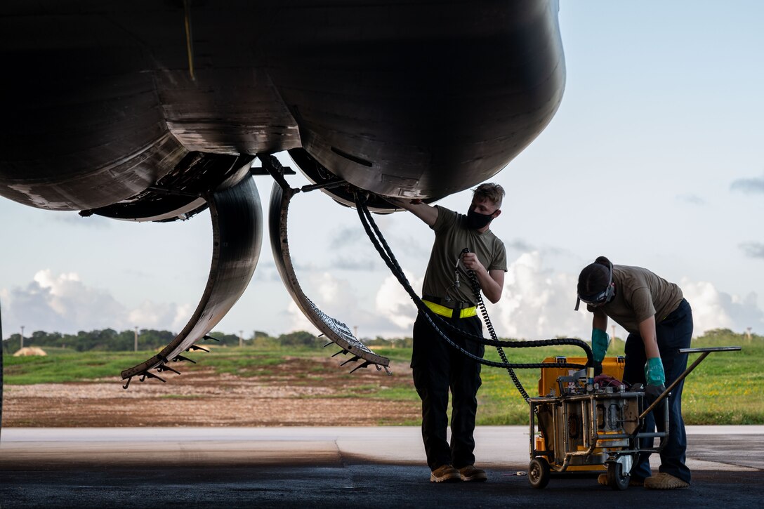 Airmen deployed from Ellsworth Air Force Base, S.D., for Bomber Task Force operations conduct a post-flight inspection on a U.S. Air Force B-1B Lancer at Andersen Air Force Base, Guam, Dec. 5, 2020. More than 150 Airmen and four B-1B Lancers assigned to the 37th Expeditionary Bomb Squadron out of Ellsworth AFB, S.D., deployed to the Pacific in support of BTF dynamic force employment. This empowers a small but agile footprint of maintenance personnel to generate airpower at locations across the globe. (U.S. Air Force photo by Senior Airman Tristan Day)