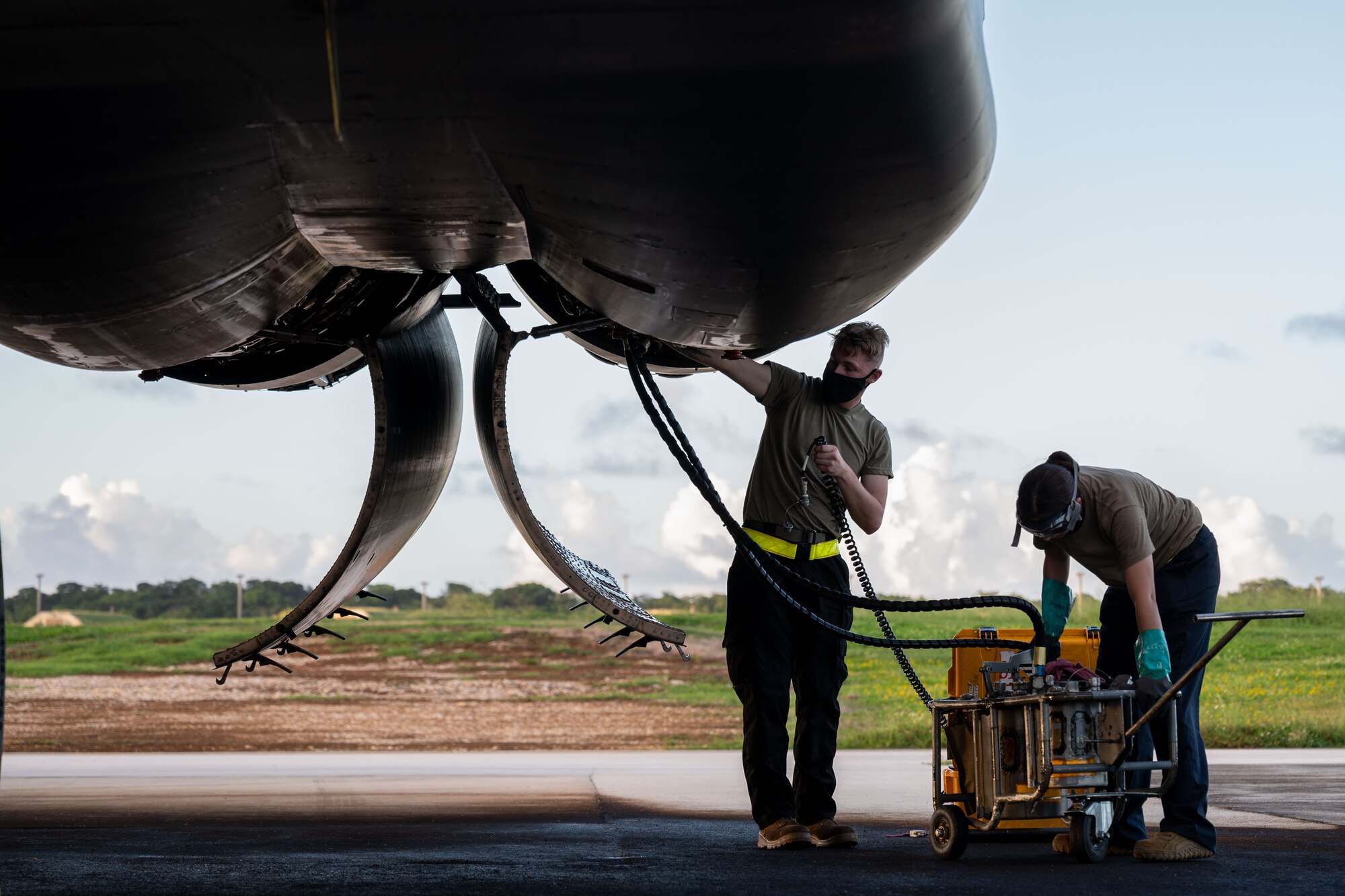 Airmen deployed from Ellsworth Air Force Base, S.D., for Bomber Task Force operations conduct a post-flight inspection on a U.S. Air Force B-1B Lancer at Andersen Air Force Base, Guam, Dec. 5, 2020. More than 150 Airmen and four B-1B Lancers assigned to the 37th Expeditionary Bomb Squadron out of Ellsworth AFB, S.D., deployed to the Pacific in support of BTF dynamic force employment. This empowers a small but agile footprint of maintenance personnel to generate airpower at locations across the globe. (U.S. Air Force photo by Senior Airman Tristan Day)