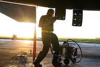 Airmen deployed for Bomber Task Force operations conduct a post-flight inspection on a U.S. Air Force B-1B Lancer at Andersen Air Force Base, Guam, Dec. 12, 2020. More than 150 Airmen and four B-1B Lancers assigned to the 37th Expeditionary Bomb Squadron  Ellsworth AFB, S.D., deployed to the Pacific in support of BTF dynamic force employment. This empowers a small but agile footprint of maintenance personnel to generate airpower at locations across the globe. (U.S. Air Force photo by Senior Airman Tristan Day)