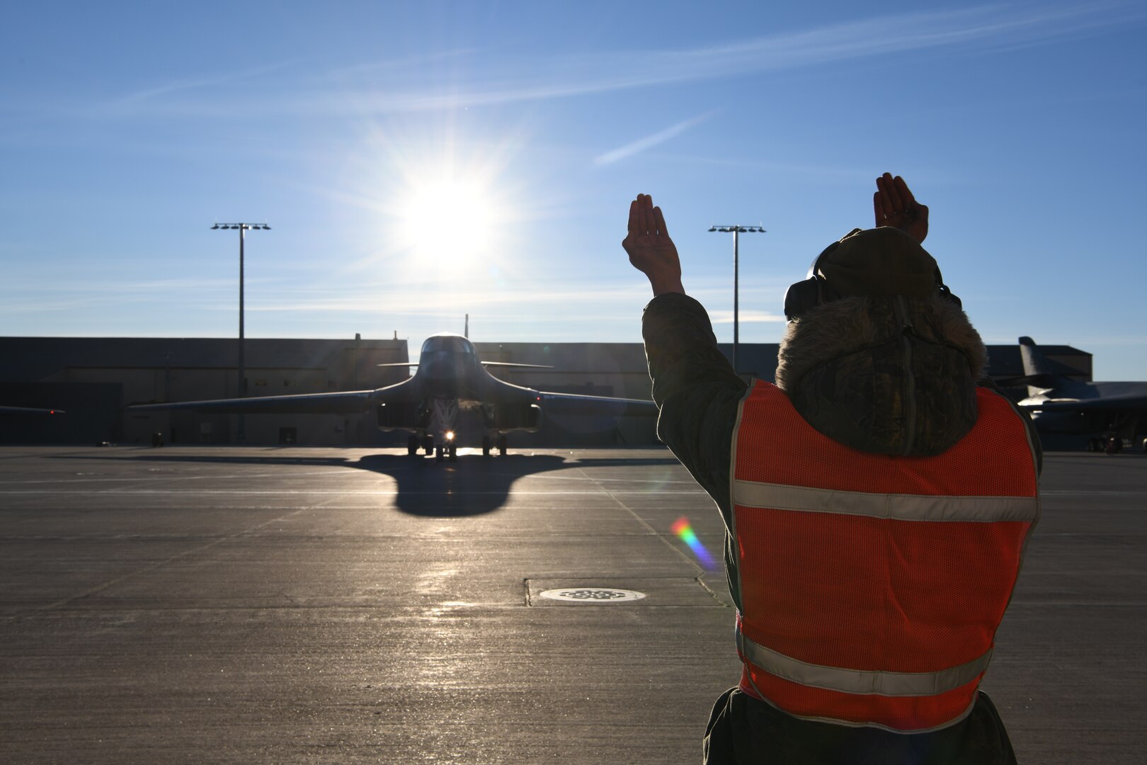A maintainer assigned to the 28th Aircraft Maintenance Squadron marshals a U.S. Air Force B-1B Lancer prior to a Bomber Task Force deployment from Ellsworth Air Force Base, S.D., Dec. 3, 2020. Approximately 200 Airmen and several B-1s assigned to the 28th Bomb Wing at Ellsworth deployed to Andersen AFB, Guam, to support Pacific Air Forces’ strategic deterrence missions to reinforce the rules-based order in the Indo-Pacific region. (U.S. Air Force photo by Staff Sgt. Nicolas Z. Erwin)