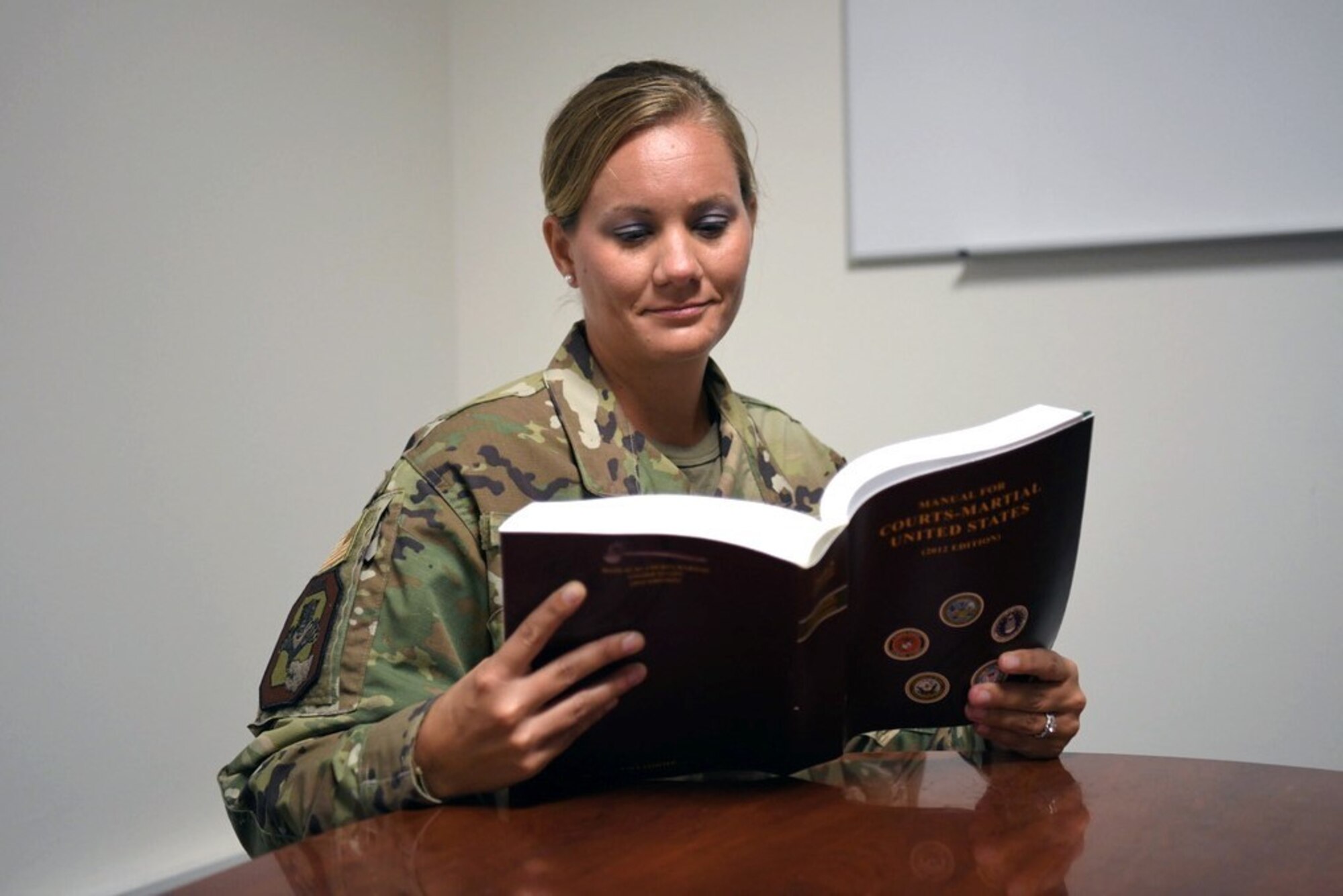 Senior Master Sgt. Erin Bouchane, the 178th Wing Law Office superintendent, reviews the Uniform Code of Military Justice.