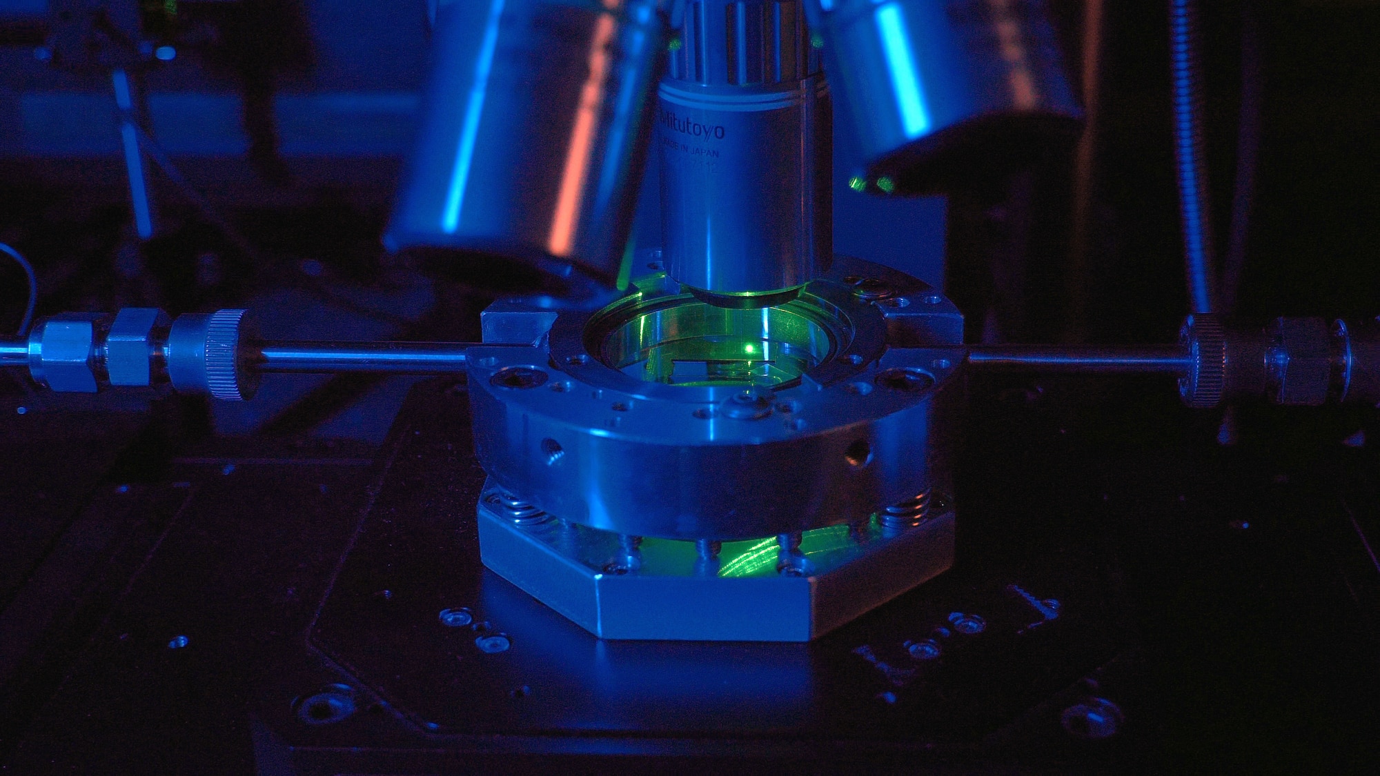 Laser writing of electronics utilizing a green laser and custom environmental chamber setup. (U.S. Air Force photo/Spencer Deer)