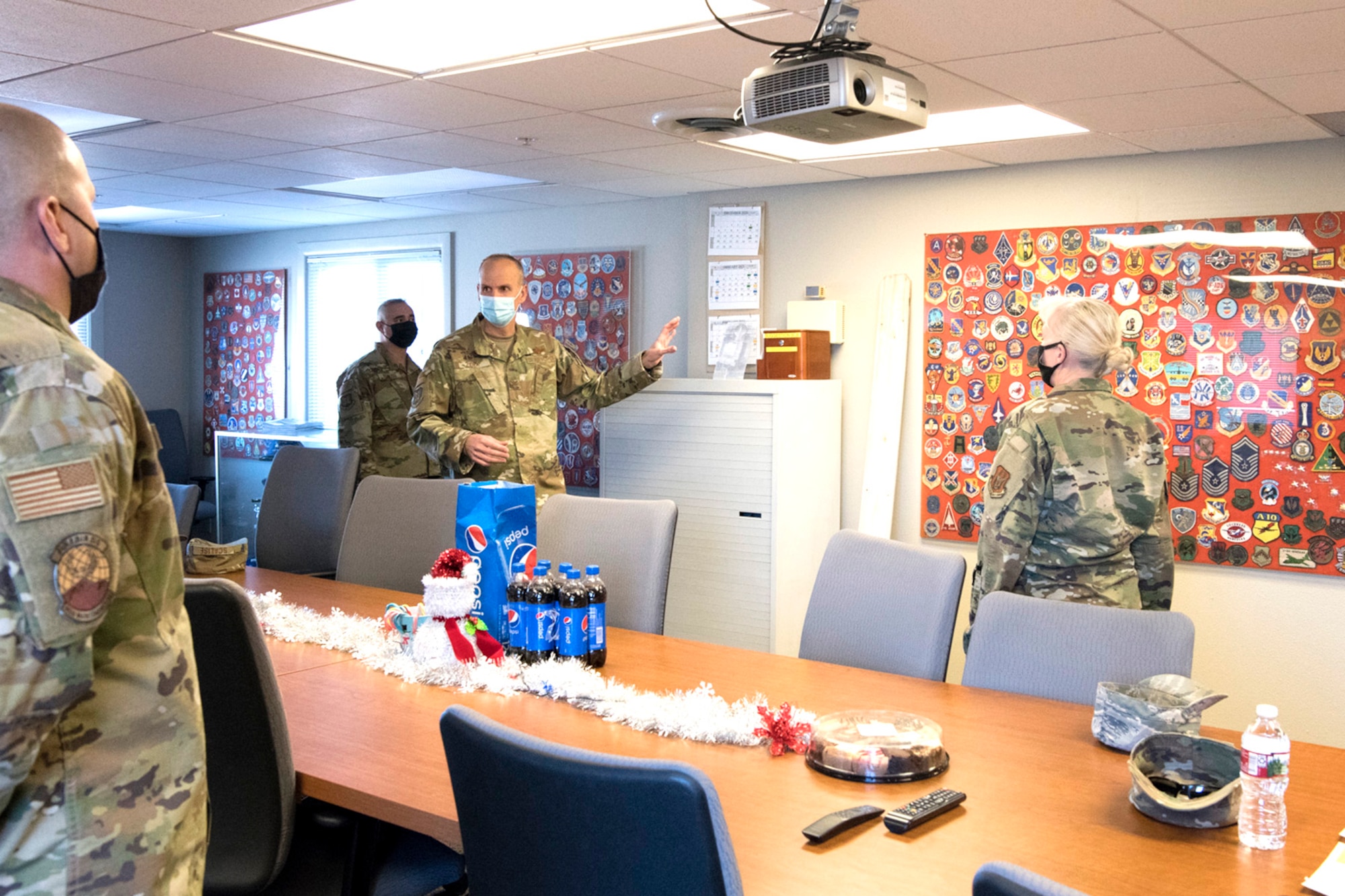 Col. Christopher Zidek (center-right), 302nd Airlift Wing commander, and Chief Master Sgt. Kahn Scalise, 302 AW command chief, visit the 302nd Maintenance Squadron Aerospace Ground Equipment during the December unit training assembly, Dec. 5, 2020, at Peterson-Schriever Garrison, Colorado.