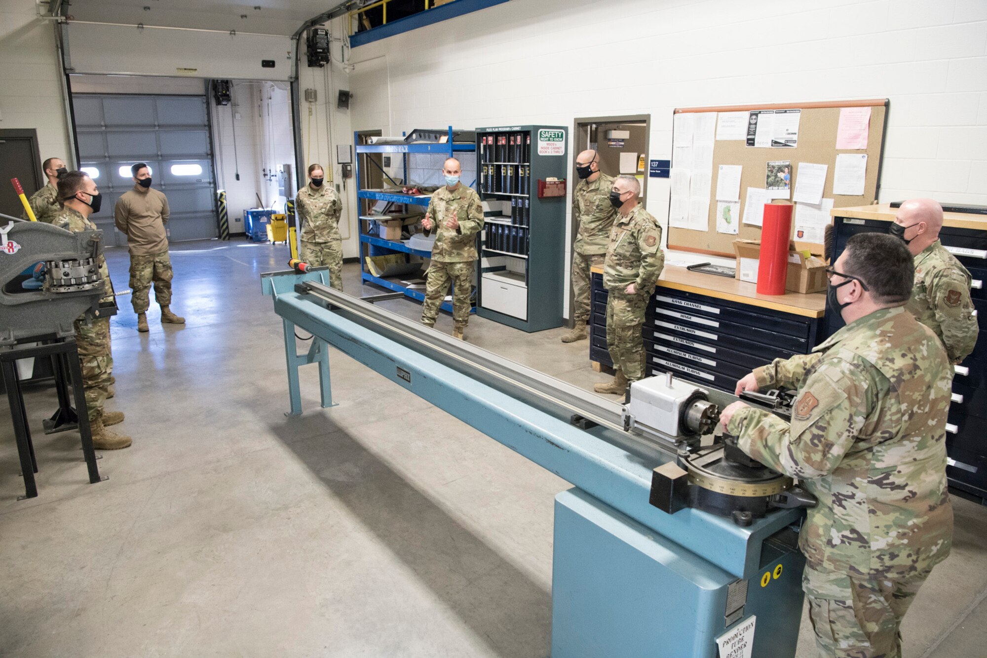 Col. Christopher Zidek (center-right), 302nd Airlift Wing commander, and Chief Master Sgt. Kahn Scalise, 302 AW command chief, visit the 302nd Maintenance Squadron reservists during the December unit training assembly, Dec. 5, 2020, at Peterson-Schriever Garrison, Colorado.