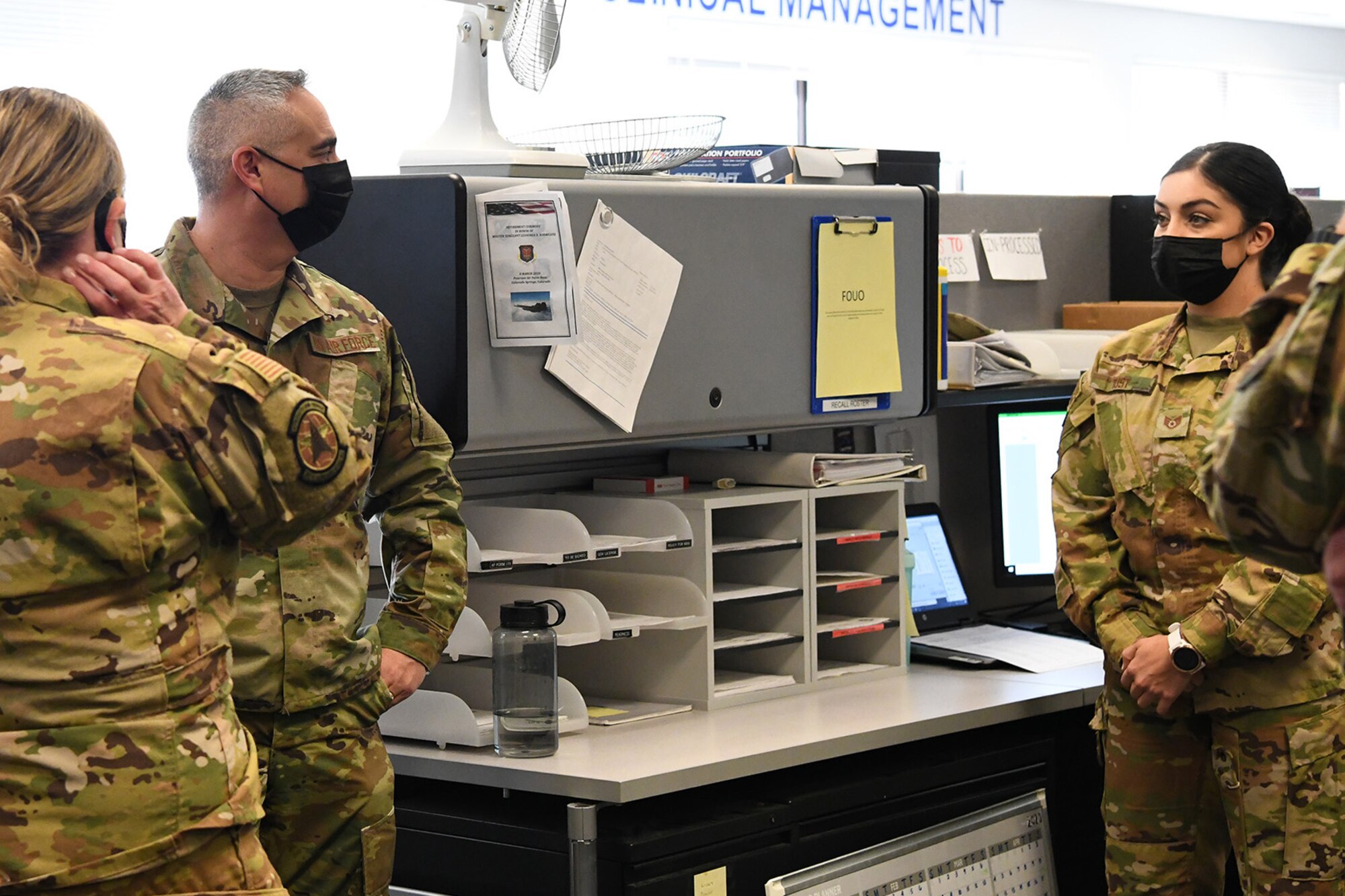 Chief Master Sgt. Kahn Scalise (center), 302nd Airlift Wing command chief, visit with reservists with the 34th Aeromedical Evacuation Squadron during the December unit training assembly, Dec. 6, 2020, at Peterson-Schriever Garrison, Colorado.