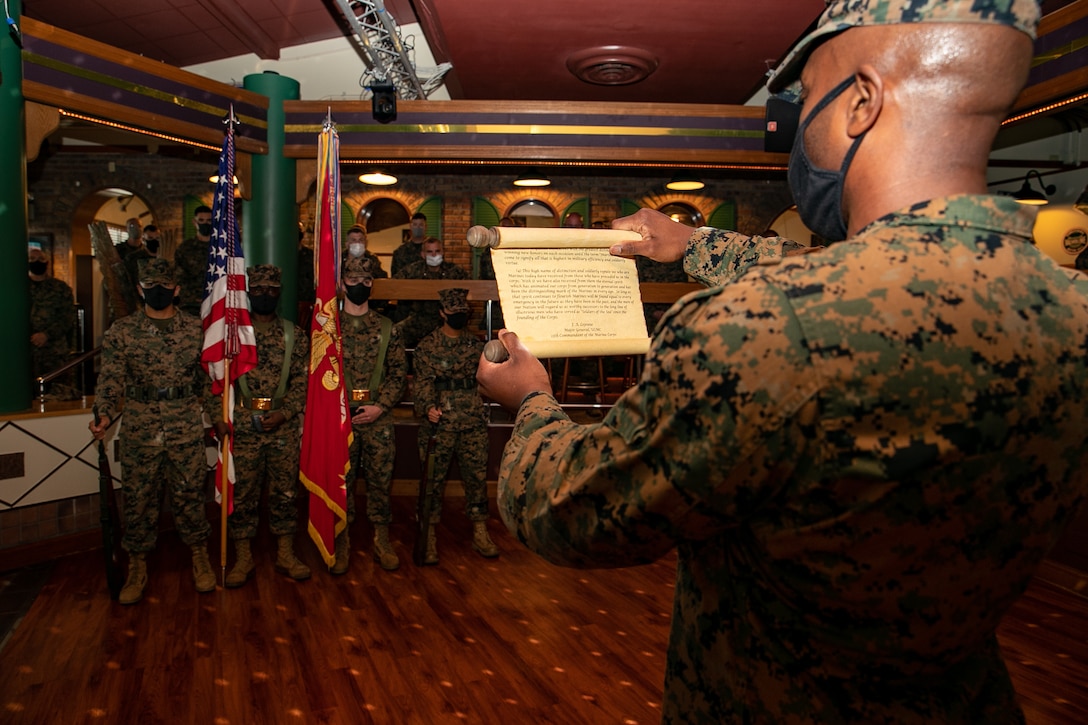 U.S Marine Corps Capt. Keith B. Elliot, the deputy G-1 with 3rd Marine Expeditionary Brigade, reads Gen. John A. Lejeune’s message during the 245th Marine Corps birthday ceremony at the Bayview Club, Camp Courtney, Okinawa, Japan, Nov. 13, 2020. Marines throughout the world celebrate the Marine Corps birthday in November. During the ceremony, a piece of cake is passed from the oldest Marine to the youngest Marine, which signifies the passing of knowledge and wisdom from one generation to the next. (U.S. Marine Corps photo by Lance Cpl. Natalie Greenwood)