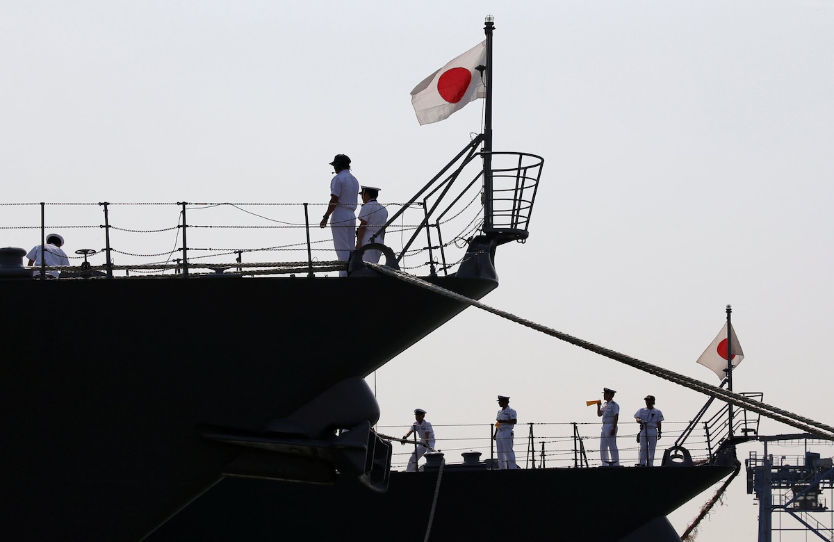 Japan Maritime Self-Defense Force personnel are seen on the destroyers JS Suzutsuki (DD 117) (L) and JS Inazuma (DD 105) after they arrive as part of an Indo-Pacific tour at Tanjung Priok Port in Jakarta, Indonesia, September 18, 2018. REUTERS/Willy Kurniawan