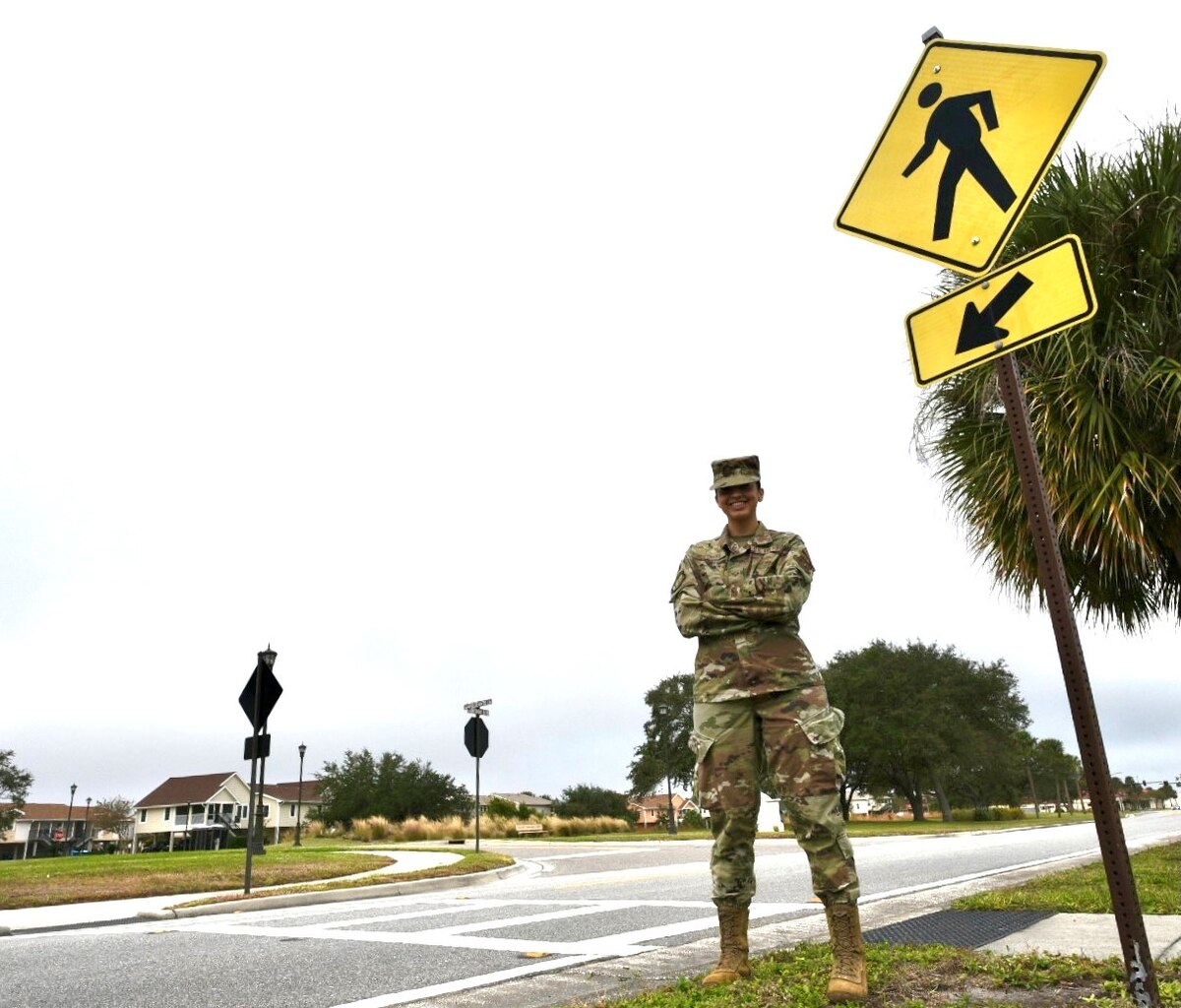 Senior Airman Pamela Restrepo, an aeromedical evacuation technician with the 927th Air Refueling Wing, MacDill Air Force Base, Florida stands near a crosswalk on Bayshore Boulevard December 5, 2020.  One month earlier, on her way home from drill, Restrepo stopped to aid a boy who was struck by a car. “Being a medic, I am on duty 24/7; it comes to use anytime, anyplace not just while I am at work,” said Restrepo.  (U.S. Air Force photo by Senior Airman Tiffany Emery)