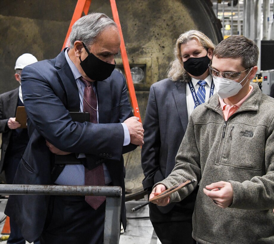 Jonathan Kodman, right, Arcs Group manager, shows Dr. Richard Joseph, left, Air Force chief scientist, a component of an arc heater during Joseph's visit to Arnold Engineering Development Complex facilities at Arnold Air Force Base, Tenn., Nov. 18, 2020. Also pictured is Dr. Thomas Fetterhoff, technical advisor for aerodynamic, propulsion and ground test and evaluation, Air Force Test Center. (U.S. Air Force photo by Jill Pickett)