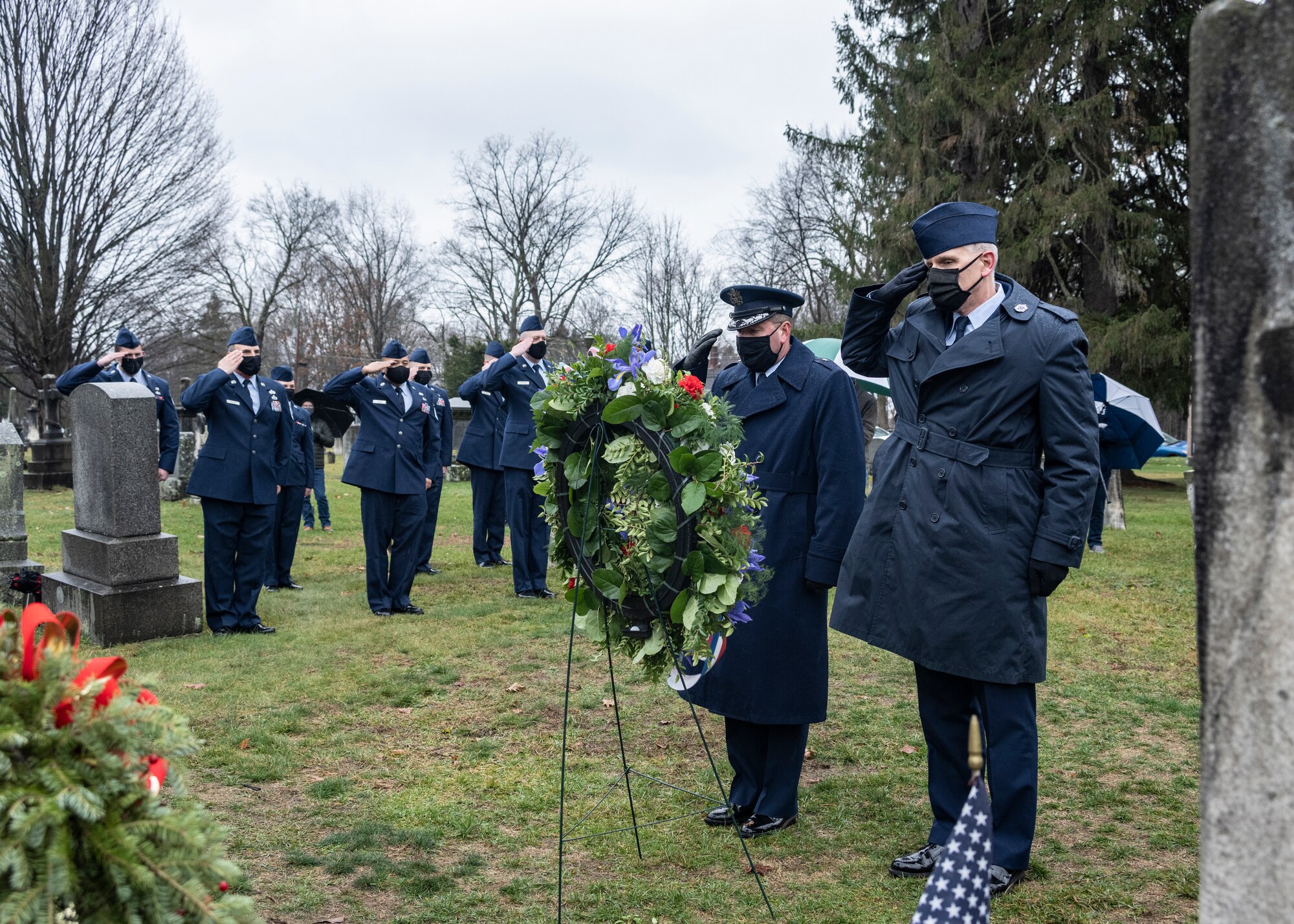 Brig. Gen. Michael Bank, the assistant adjutant general – air for New York state, Chief Master Sgt. Jeffrey Trottier and other members of the New York Air National Guard salute the resting place of former President Martin Van Buren during a ceremony commemorating his birthday at the Kinderhook Reformed Church Cemetery in Kinderhook, New York. Van Buren was the eighth president of the United States and a native of Kinderhook.