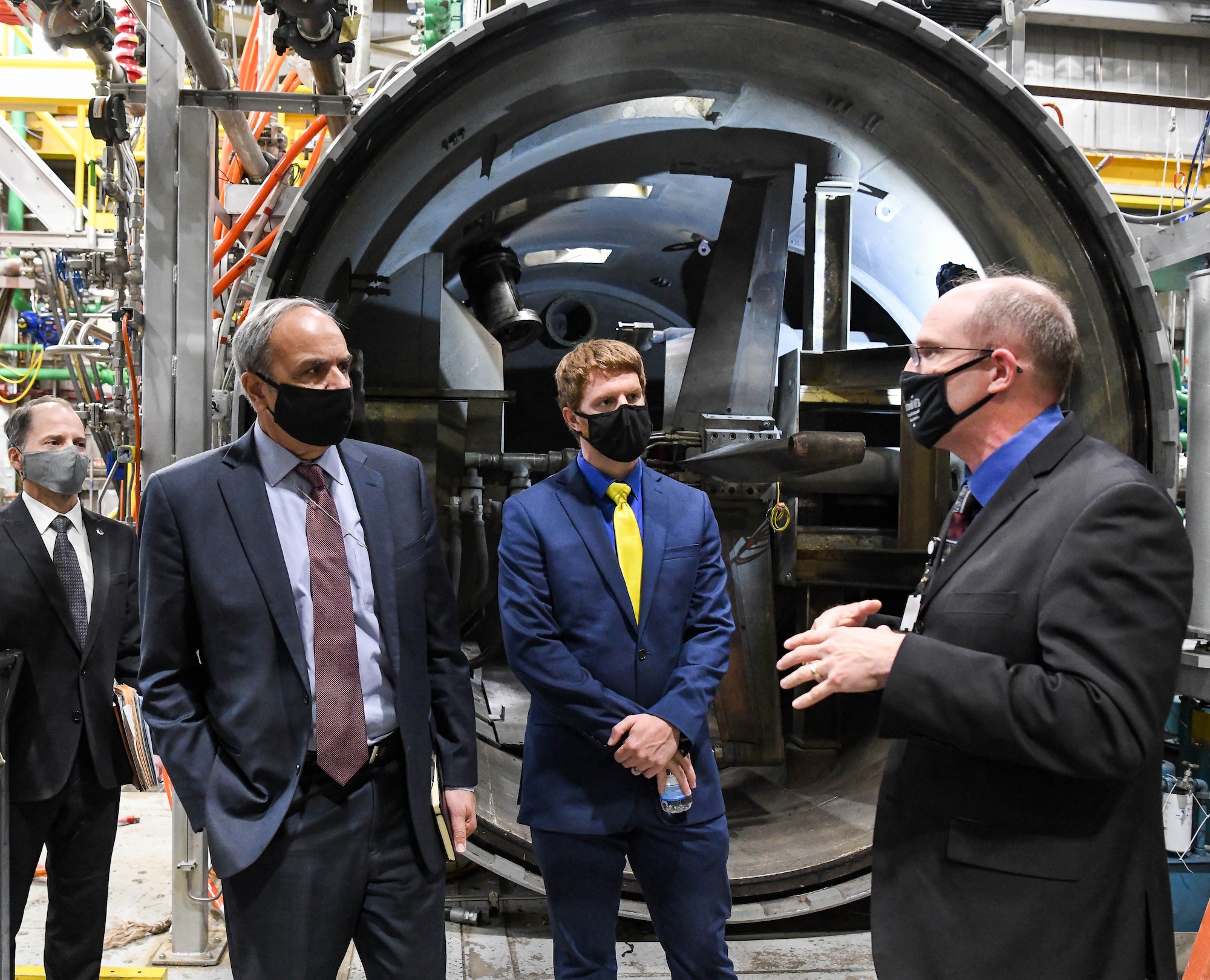 Lance Baxter, right, chief of the Hypersonic Systems Test Branch, Test Division, Arnold Engineering Development Complex, speaks about the support of hypersonic test and evaluation to Dr. Richard Joseph, second from left, Air Force chief scientist, and Dr. Chad Waddington, special assistance to the AF chief scientist, during a visit to Arnold Air Force Base, Tenn., Nov. 18, 2020. Also pictured is Ed Tucker, AEDC senior technical director. AEDC supports hypersonic weapons development in many of its facilities. (U.S. Air Force photo by Jill Pickett) (This image has been altered by obscuring a badge for security purposes.)