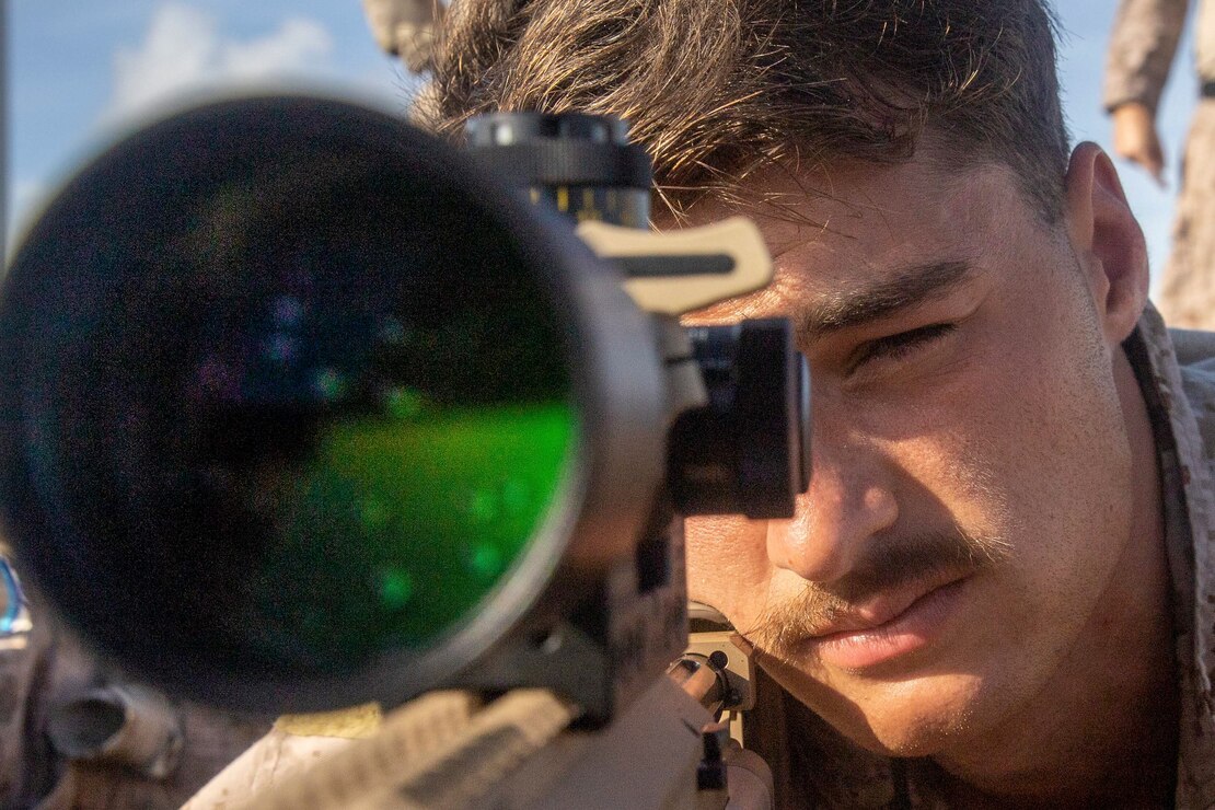 A U.S. Marine prepares to fire during a sniper range with Netherlands Marines near Netherlands Marine Barracks Savaneta, Aruba, Nov. 23.