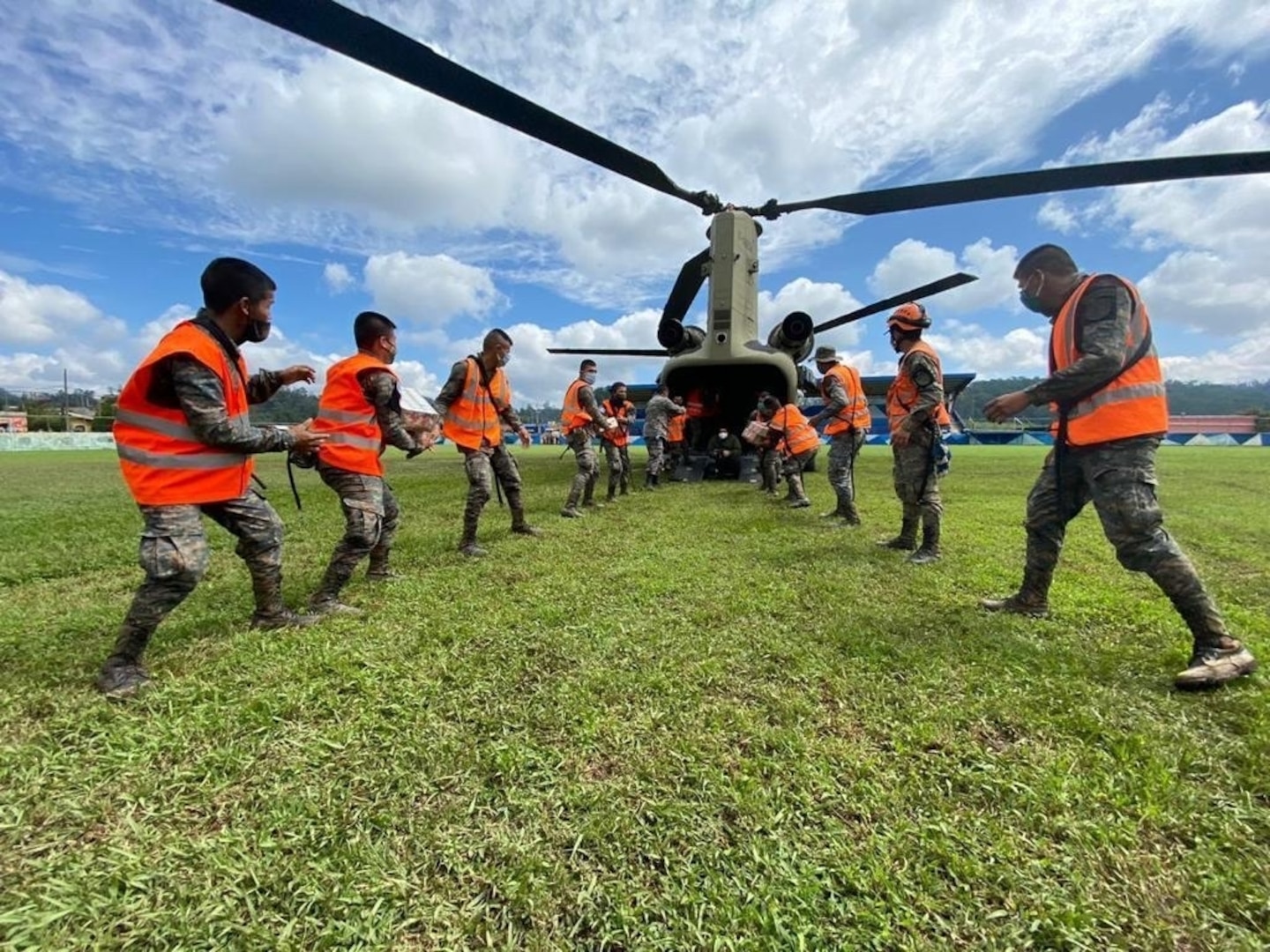 Joint Task Force-Bravo unloads emergency supplies from a U.S. Army CH-47 Chinook