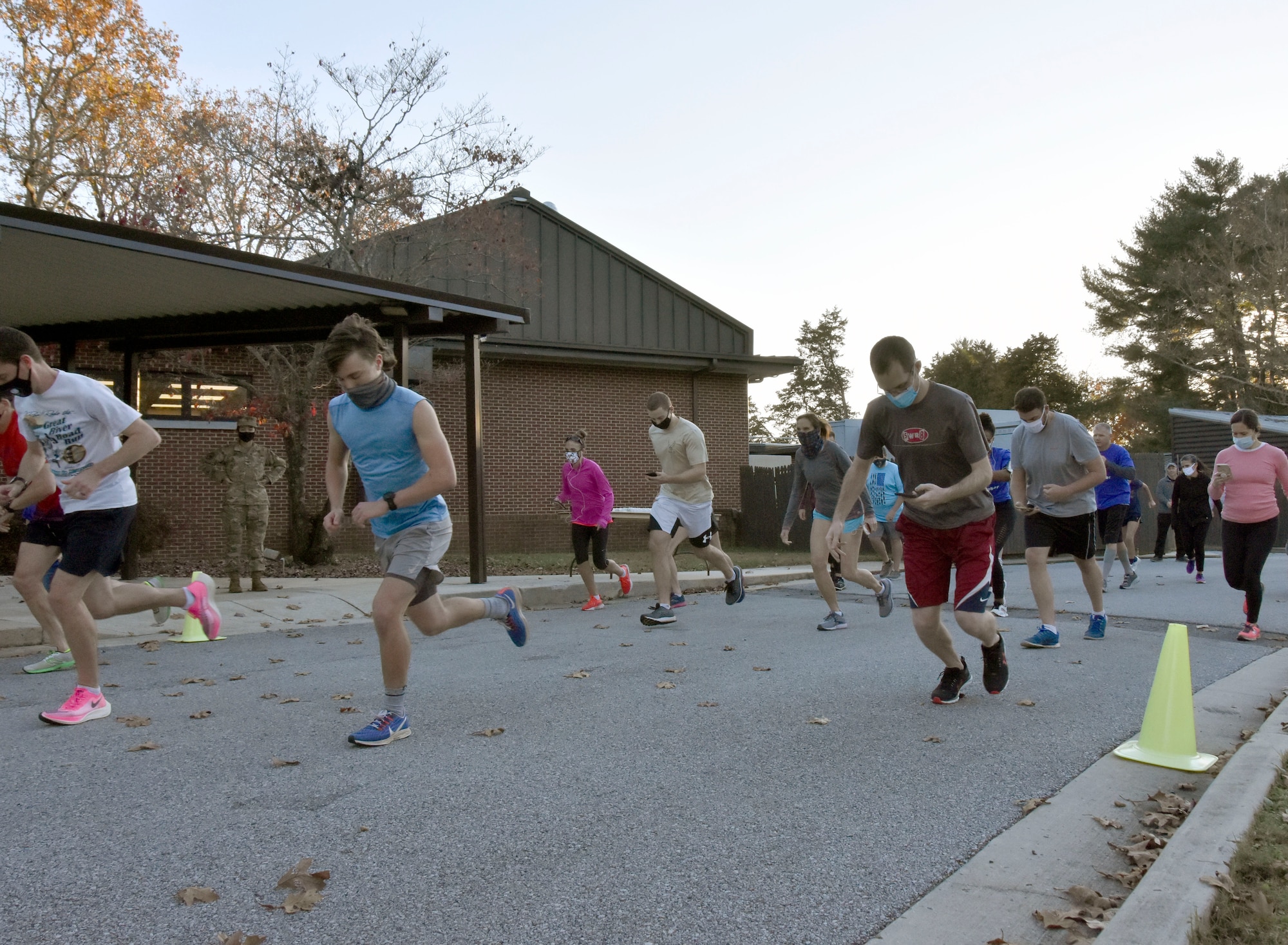 Runners sprint from the starting line during the 35th annual AEDC Turkey Trot, Nov. 13, 2020, at the Arnold Lakeside Complex on Arnold Air Force Base, Tenn. COVID-19 risk mitigation measures were implemented for this year’s race, including the wearing of masks at the starting line and maintaining social distancing when possible on the course. (U.S. Air Force photo by Bradley Hicks)