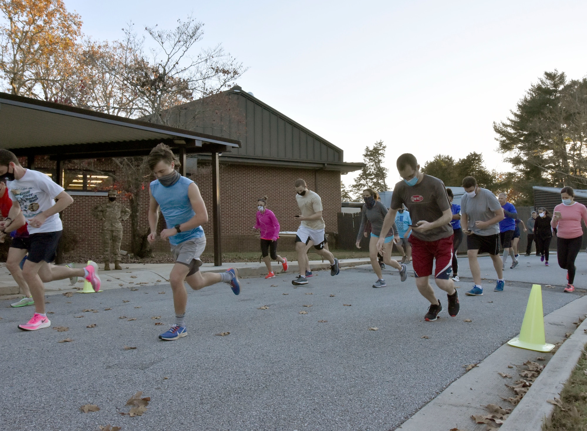 Runners sprint from the starting line during the 35th annual AEDC Turkey Trot, Nov. 13, 2020, at the Arnold Lakeside Complex on Arnold Air Force Base, Tenn. COVID-19 risk mitigation measures were implemented for this year’s race, including the wearing of masks at the starting line and maintaining social distancing when possible on the course. (U.S. Air Force photo by Bradley Hicks)