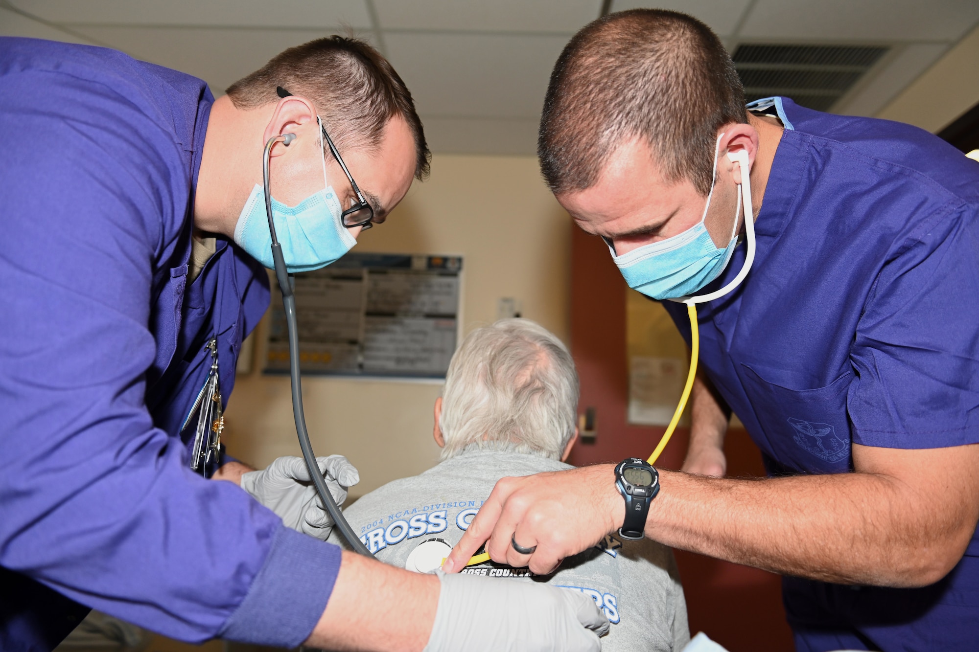 U.S. Air Force 1st Lt. Zachariah Bingham, left, 60th Inpatient Therapeutic Squadron clinical nurse, and Col. Zachery Jiron, 60th Air Mobility Wing vice commander, check vitals of a patient during Leadership Rounds Dec. 4, 2020, at Travis Air Force Base, California. The Leadership Rounds program provides 60th AMW leadership an opportunity to interact with Airmen and receive a detailed view of each mission performed at Travis AFB. (U.S. Air Force photo by Senior Airman Cameron Otte)