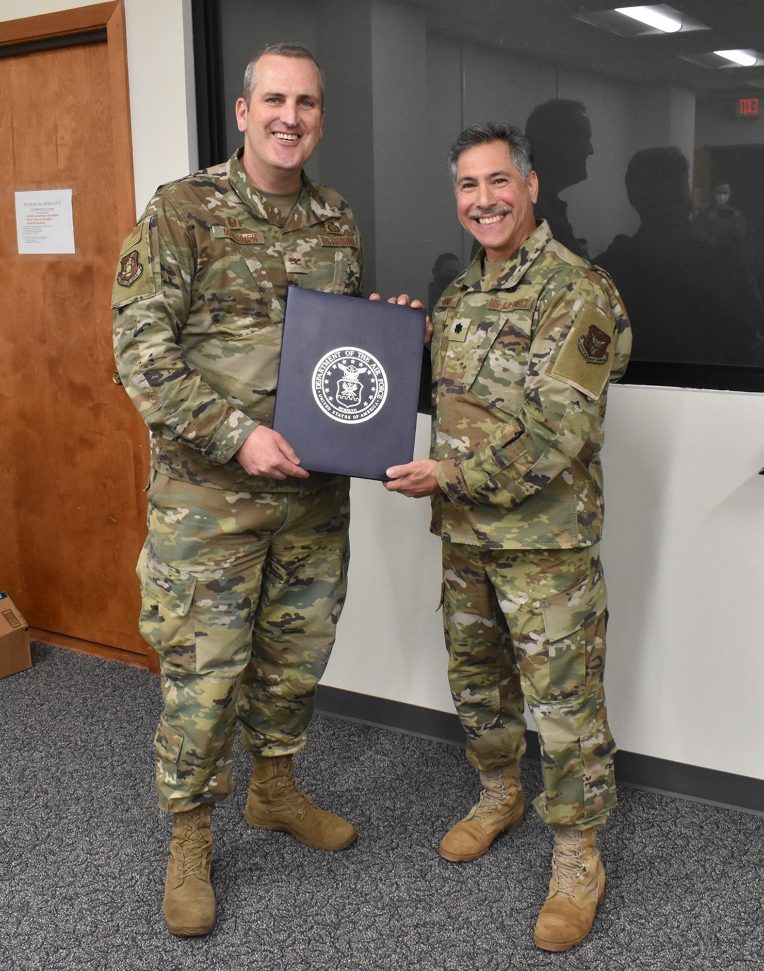 Col. Joseph Marcinek, 655th Intelligence, Surveillance, and Reconnaissance Wing commander, presents Lt. Col. Thomas Danas, 655th ISR Group deputy commander, his retirement certificate during the Dec. 5, 2020 unit training assembly. Danas has held multiple positions within the enterprise since 2013 with both the 16 Intelligence Squadron and 655 ISRG and is retiring after more than 41 years of service; over 20 years enlisted and over 20 years as an officer.