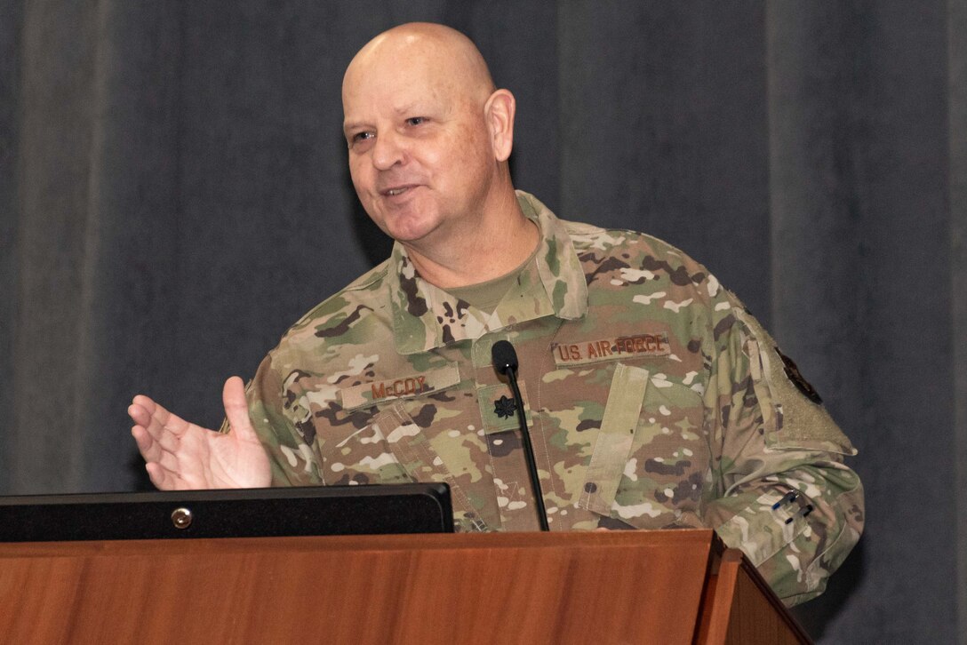 Photo of Lt. Col. McCoy speaking at podium.