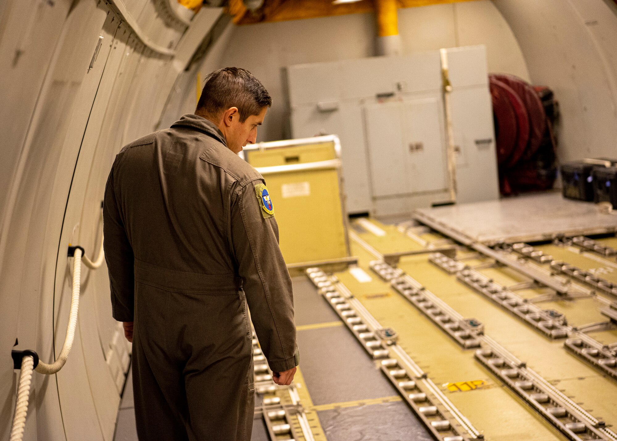 An Airman performs a readiness check on an aircraft.