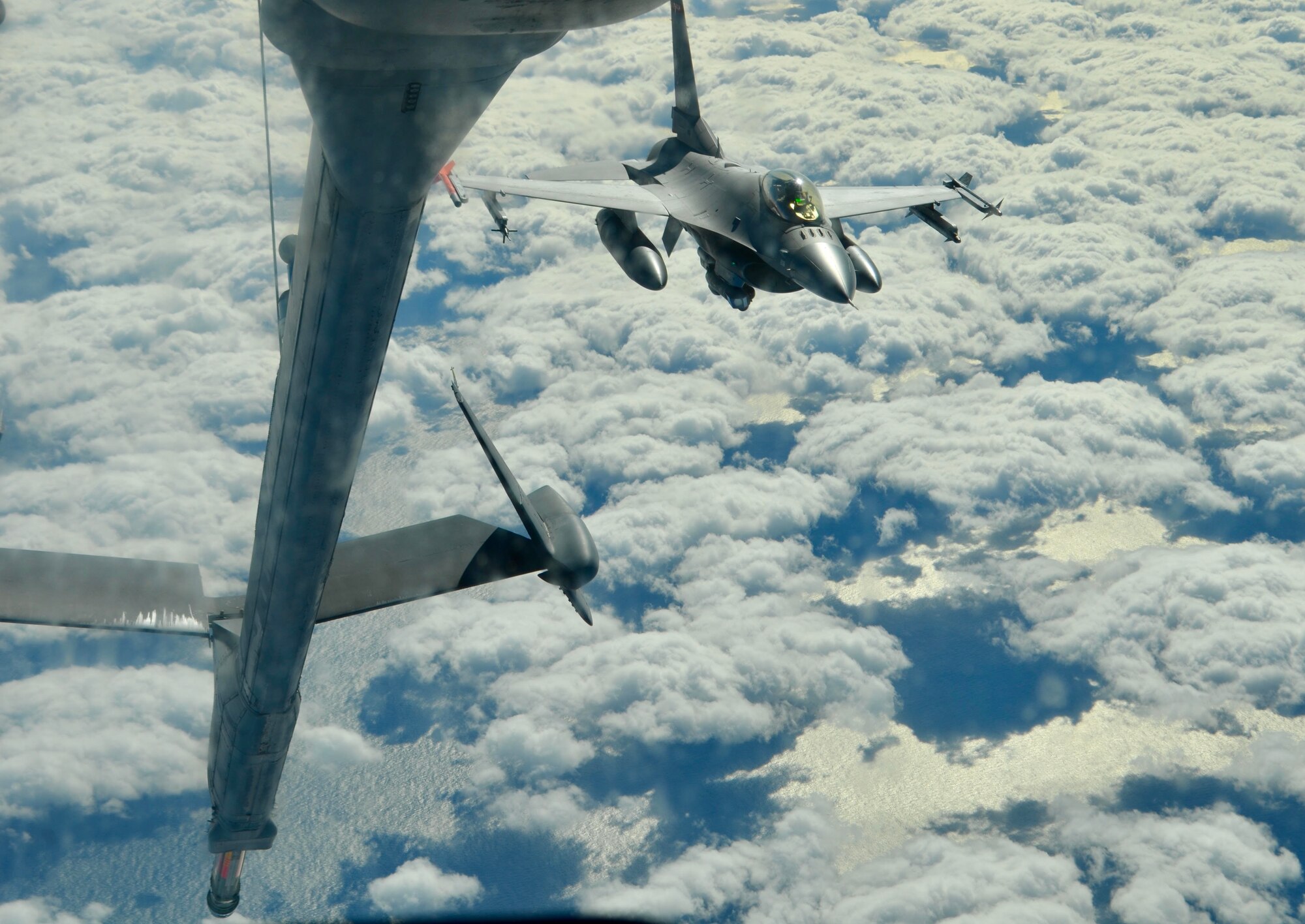 An F-16 approaches a refueling aircraft.