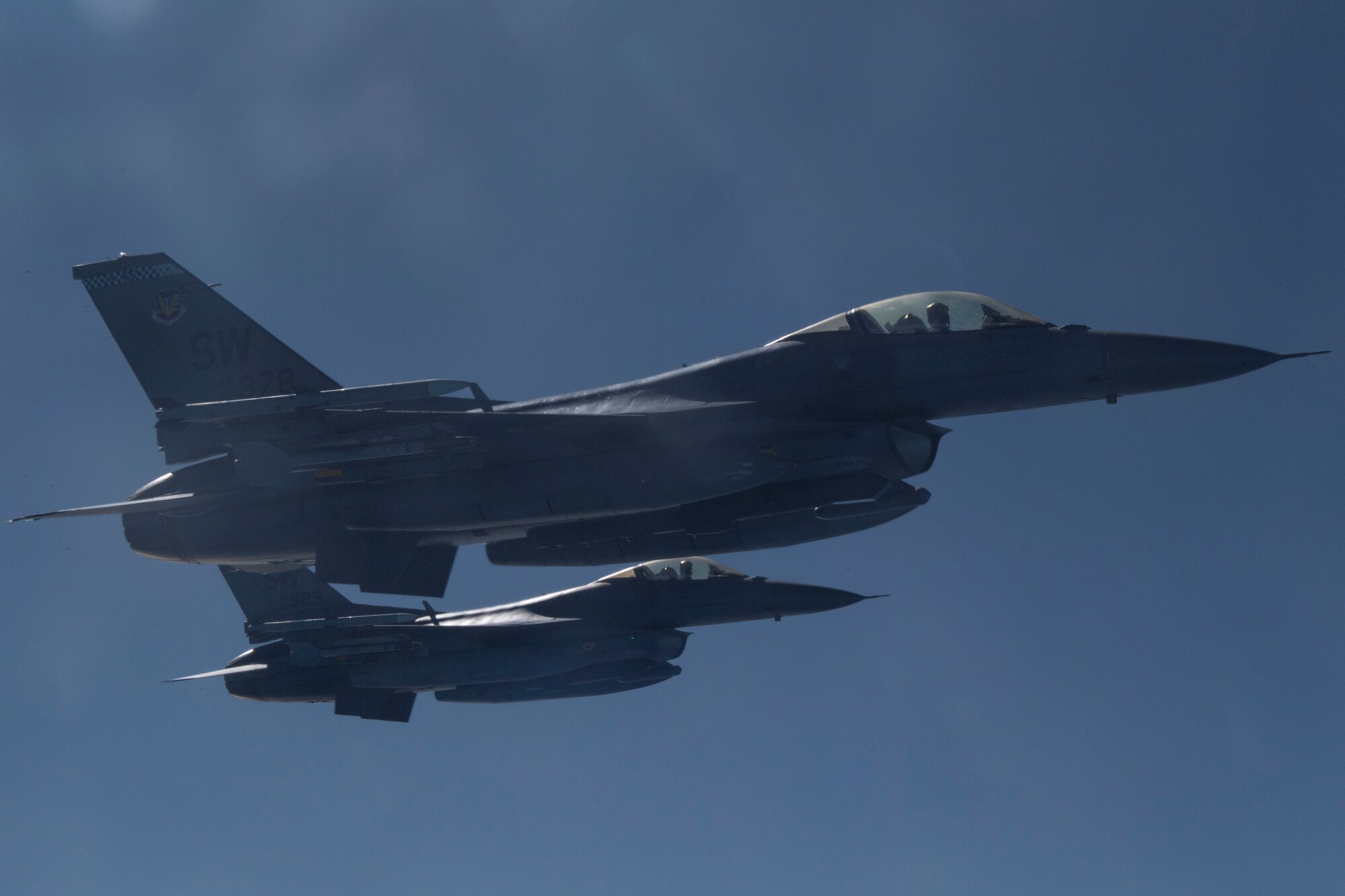 F-16 Fighting Falcon aircraft assigned to Shaw Air Force Base (AFB), South Carolina, fly in formation to provide defensive air support to KC-135 Stratotanker aircraft assigned to MacDill AFB, Florida, during a training scenario, Dec. 2, 2020.