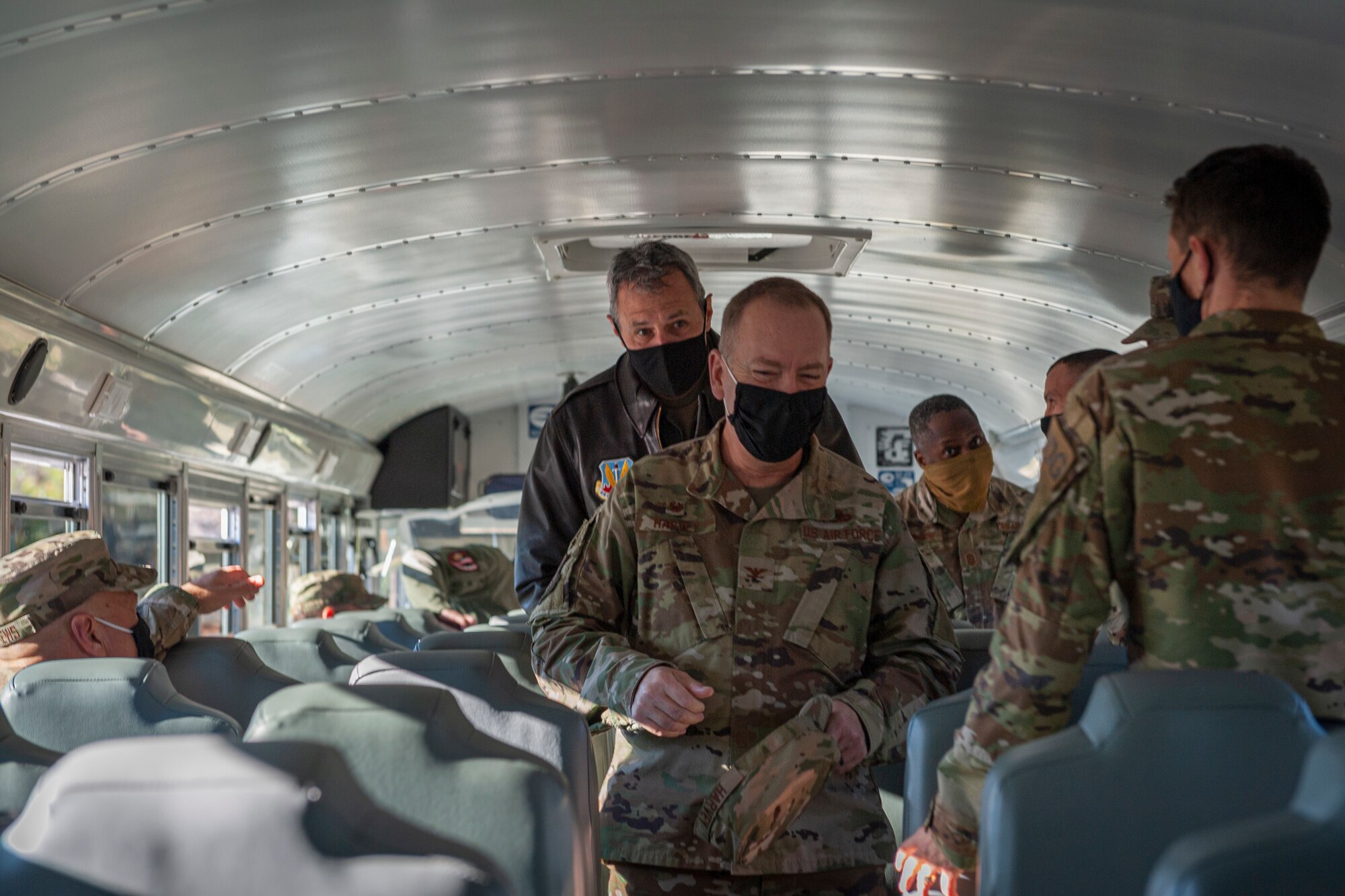 Photo of Team Moody leadership boarding a bus
