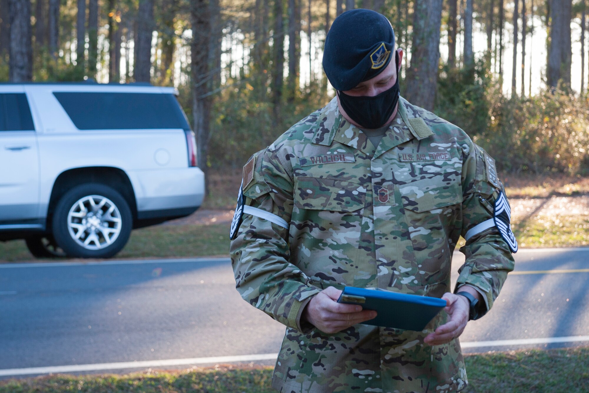 Photo of an Airman looking at a certificate