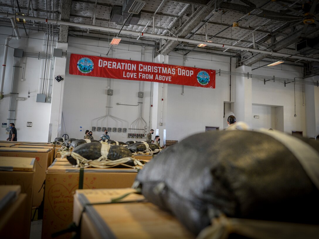 Bundles housed in the 734th Air Mobility Squadron warehouse await to be loaded onto a C-130J Hercules during the Operation Christmas Drop “Push” Ceremony at Andersen Air Force Base, Guam, Dec. 7, 2020.