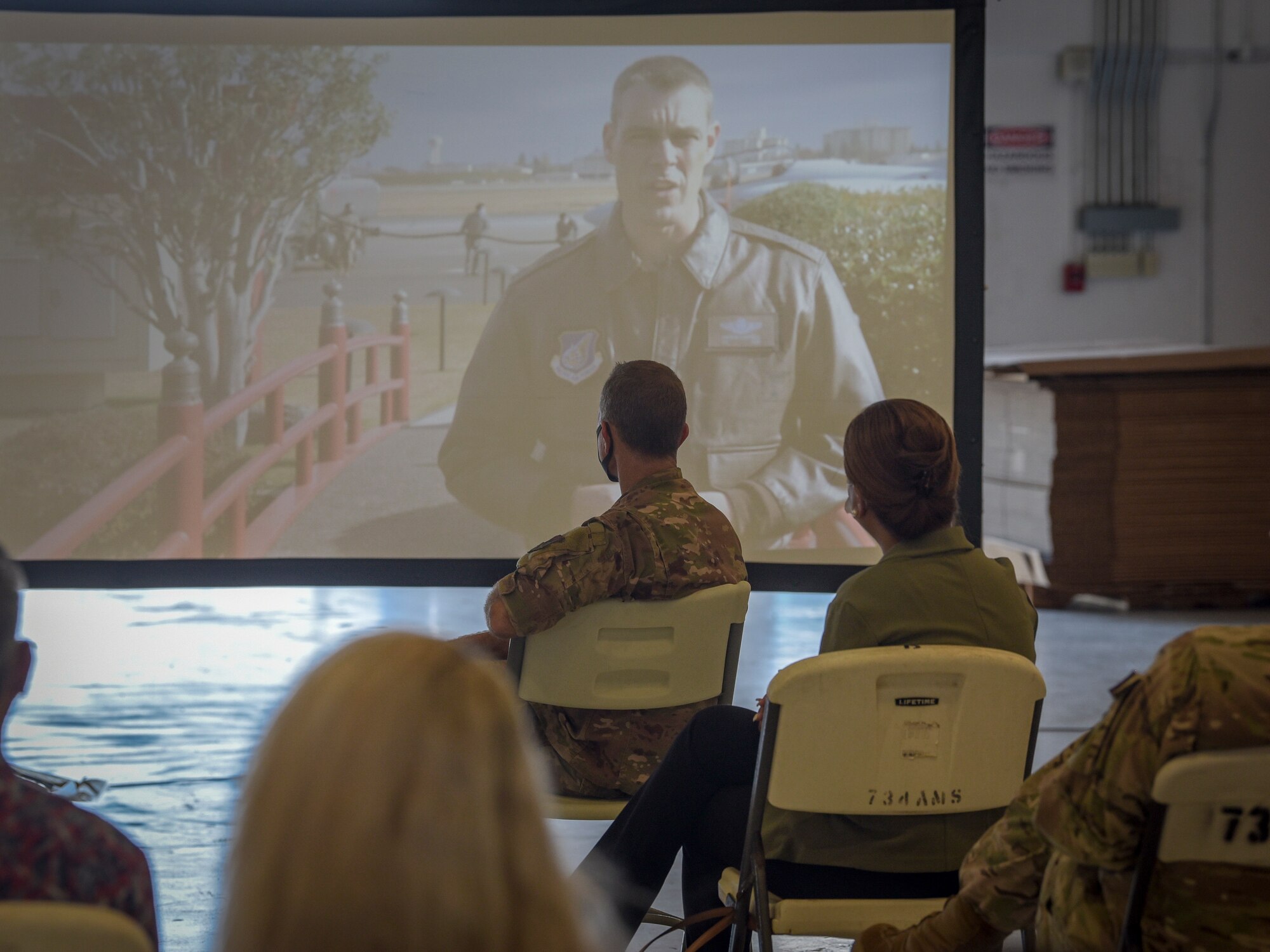 Col. Andrew Campbell, 374th Airlift Wing commander, virtually speaks at the Operation Christmas Drop “Push” Ceremony at Andersen Air Force Base, Guam, Dec. 7, 2020.