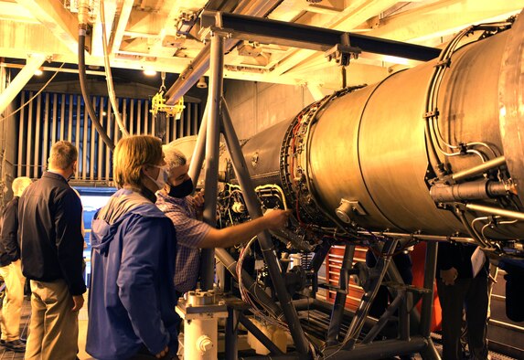 Bernie Williamson, right, the Aeropropulsion technology lead for the Test Systems Branch, speaks to Tom Serbowicz, co-chair of the Propulsion Instrumentation Working Group, Oct. 28, 2020, about how the F404 engine testbed in the Arnold Engineering Development Complex Sea Level 1 engine test cell at Arnold Air Force Base, Tenn., will be used in maturing new turbine engine instrumentation. (U.S. Air Force Photo by Deidre Moon)