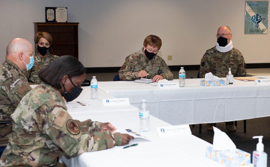 Lt. Gen. Dorothy Hogg, center, Air Force Surgeon General, attends a meeting at the 82nd Medical Group at Sheppard Air Force Base, Texas, Dec. 2, 2020. With COVID-19 still presenting challenges to overall Force Wellbeing, Hogg visited the 82nd MDG to thank them and encourage them that every one of them who wears the medical badge is keeping the Air Force ready and fit to fight. (U.S. Air Force photo by Senior Airman Pedro Tenorio)