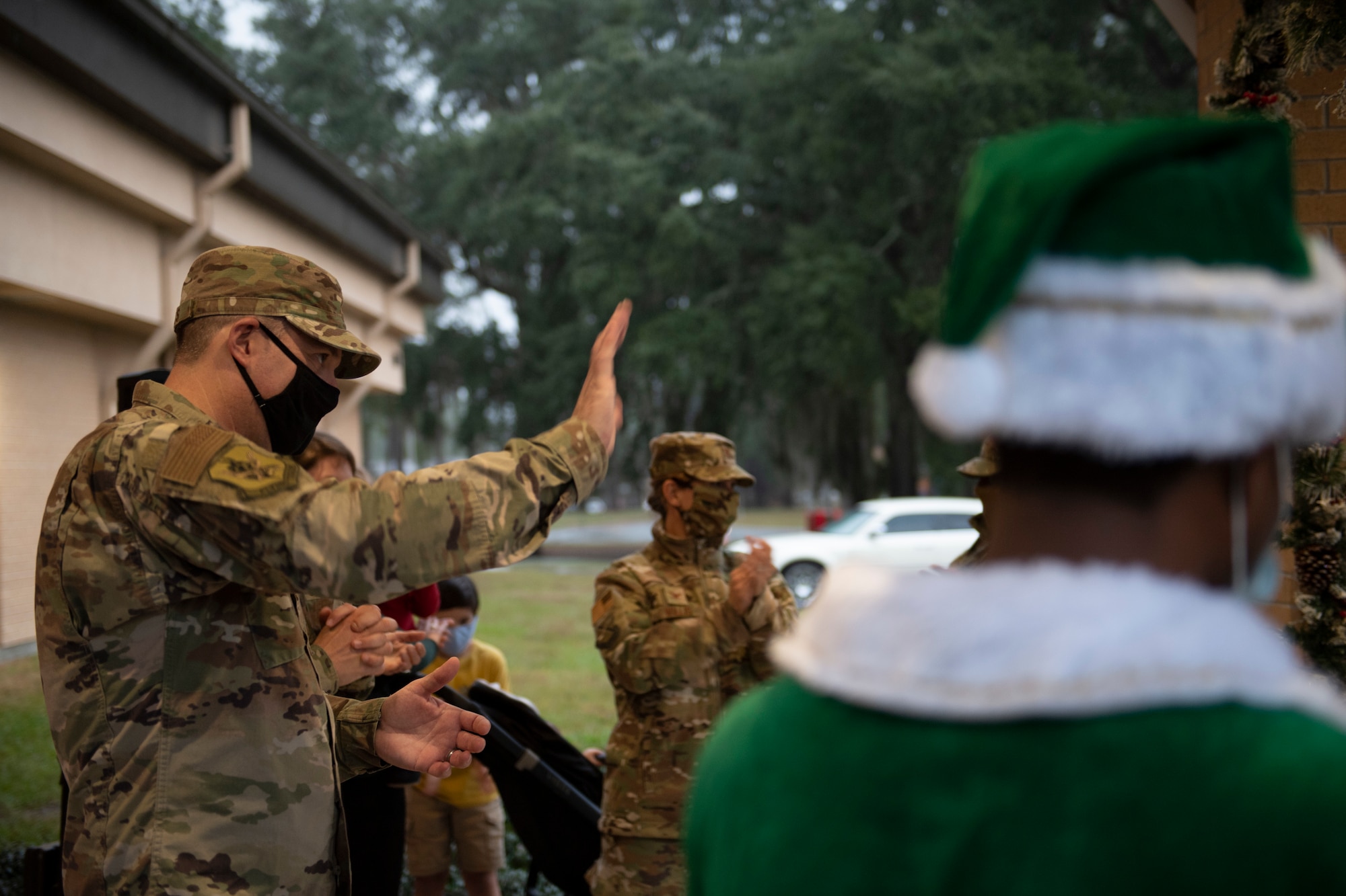 A photo of Col. Dan Walls waving to the audience during a virtual tree-lighting ceremony.