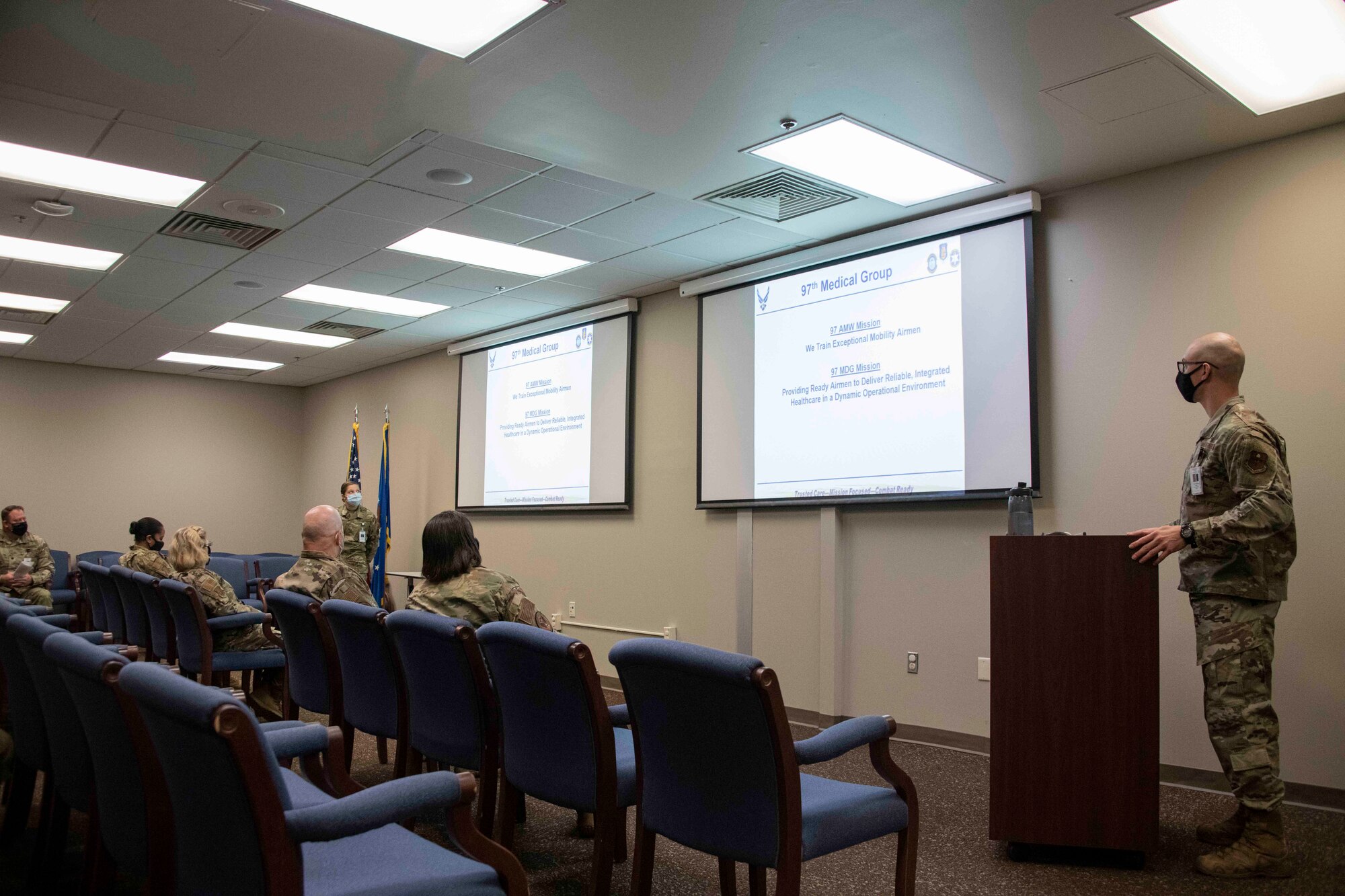 military members listen to a presentation