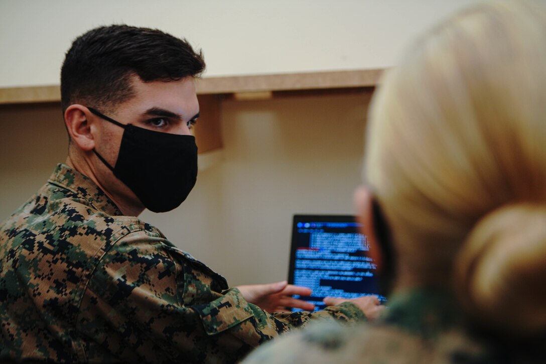 U.S. Marine Corps Lance Cpl. Ian Bergman, a defensive cyberspace operator, with 9th Communication (Comm) Battalion, I Marine Expeditionary Force Information Group, hacks into a system while engaged in the Marine Corps 2020 Cyber Games at Marine Corps Base Camp Pendleton, California, Nov. 19, 2020. 9th Comm participated in the cyber games to enhance their skills and to develop tactics and techniques while competing against other teams across the United States. (U.S. Marine Corps photo by Lance Cpl. Patrick Katz)