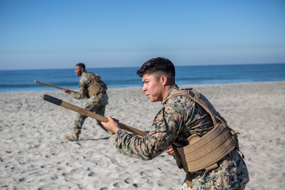 U.S. Marines with 9th Communication Battalion, I Marine Expeditionary Force Information Group test bayonet techniques during their Marine Corps Martial Arts Program (MCMAP) Instructor course culminating event at Marine Corps Base Camp Pendleton, California, Oct. 29, 2020. MCMAP trains Marines in unarmed combat, edged weapons, weapons of opportunity, and rifle and bayonet techniques.  (U.S. Marine Corps photo by Lance Cpl. Marcus Melara)