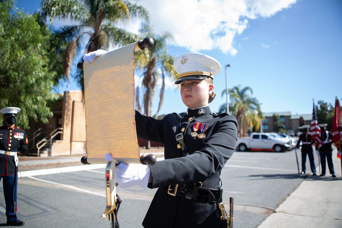 U.S. Marine Corps 2nd Lt. Hattie Smith, a manpower officer with I Marine Expeditionary Force Information Group (I MIG) reads the 13th Commandant Gen. John A. Lejeune’s, birthday message during a cake cutting ceremony at Marine Corps Base Camp Pendleton, California, Nov. 9, 2020. I MIG hosted the cake cutting ceremony in lieu of the Marine Corps 245th Birthday Ball to honor the long standing tradition of celebrating the birth date and legacy of the United States Marine Corps. (U.S. Marine Corps photo by Cpl. Tia D. Carr)