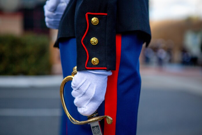 A U.S. Marine with I Marine Expeditionary Force Information Group (I MIG) wields a noncommissioned officer sword in formation during a cake cutting ceremony at Marine Corps Base Camp Pendleton, California, Nov. 9, 2020. I MIG hosted the cake cutting ceremony in lieu of the Marine Corps 245th Birthday Ball to honor the long standing tradition of celebrating the birth date and legacy of the United States Marine Corps. (U.S. Marine Corps photo by Cpl. Tia D. Carr)