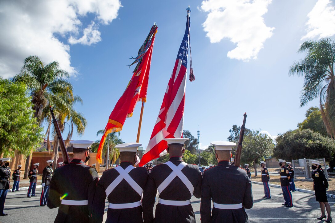 U.S. Marines with I Marine Expeditionary Force Information Group (I MIG) color guard march the colors during a cake cutting ceremony at Marine Corps Base Camp Pendleton, California on Nov. 9, 2020. I MIG hosted the cake cutting ceremony in lieu of the Marine Corps 245th Birthday Ball to honor the long standing tradition of celebrating the birth date and legacy of the United States Marine Corps. (U.S. Marine Corps photo by Cpl. Tia D. Carr)