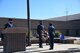Airmen saluting a wreath