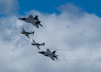 U.S. Air Force Capt. Kristin “Beo” Wolfe, F-35 Demonstration Team pilot, flies alongside Maj. Joshua “Cabo” Gunderson, F-22 Demonstration Team pilot, and two P-51 Mustangs as part of a heritage flight formation Aug. 30, 2020, Orange County Airport, NY. The heritage flight was flown as part of the 2020 New York Air Show, which was held in a drive-in format. (U.S. Air Force photo by Capt. Kip Sumner)