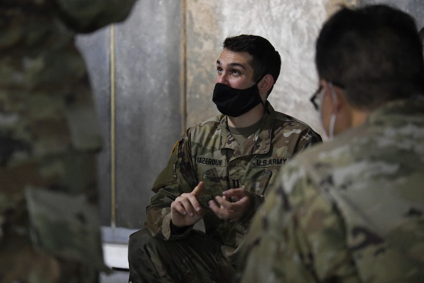 U.S. Army Capt. Alex Kazernouri, course instructor and veterinarian at Ft. Belvoir, Va., briefs 316th Medical Group members about military working dog catheter insertion techniques during a Canine Tactical Combat Casualty Care Course, an annual training course designed to teach medical professionals how to aid wounded MWDs in deployed conditions, at Malcolm Grow Medical Clinics and Surgery Center at Joint Base Andrews, Md., Nov. 12, 2020.