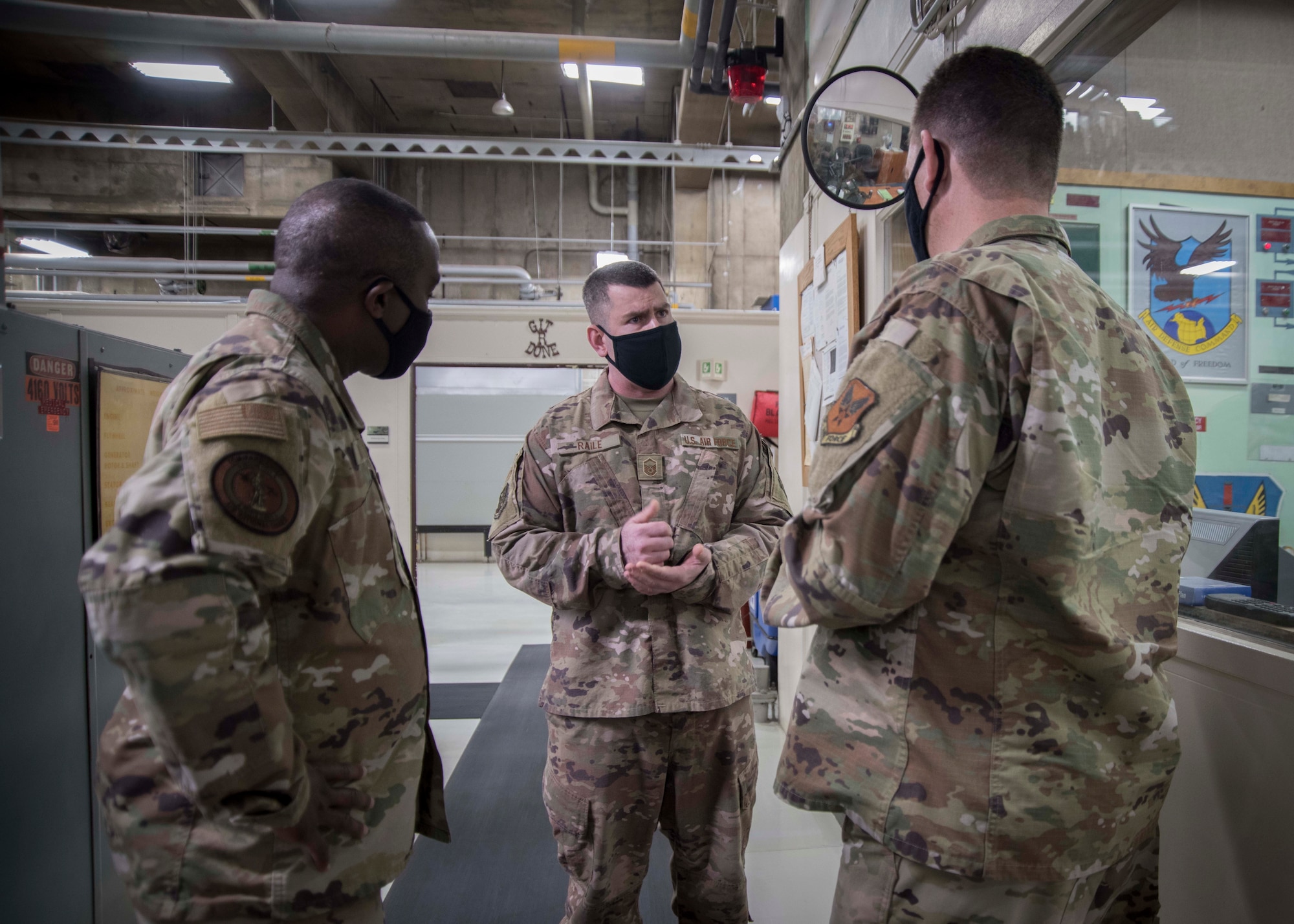 Airman talking to DANG and Command Chief