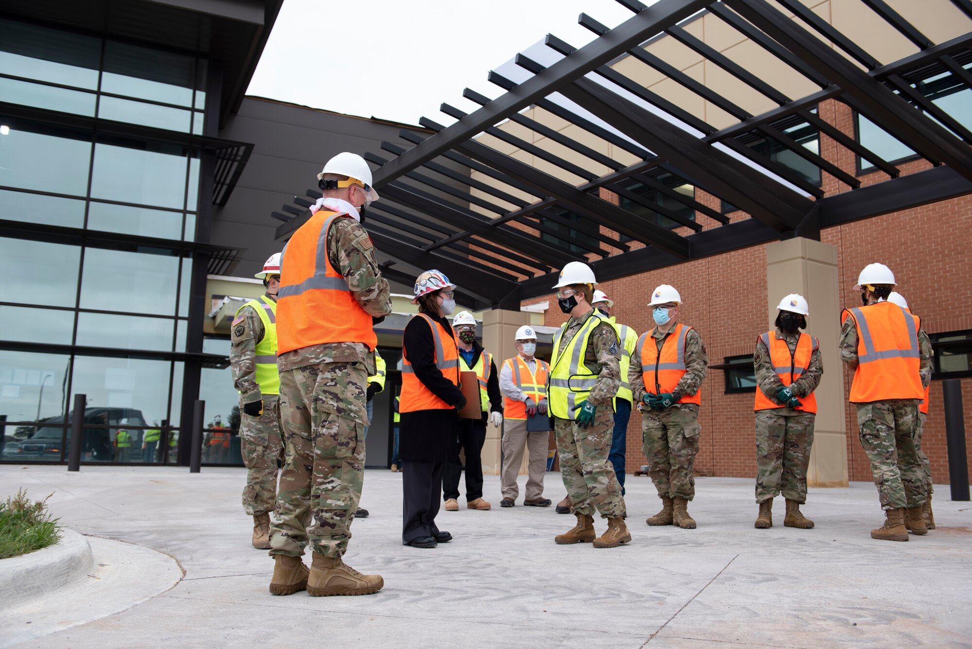 Lt. Gen. Dorothy Hogg, center yellow jacket, and her entourage tour the almost completed new medical facility on Sheppard Air Force Base, Texas, Dec. 2, 2020. With the construction of the new medical facility on base, the 82nd MDG is already showing their commitment to quality care and full spectrum medical readiness. (U.S. Air Force photo by Senior Airman Pedro Tenorio)