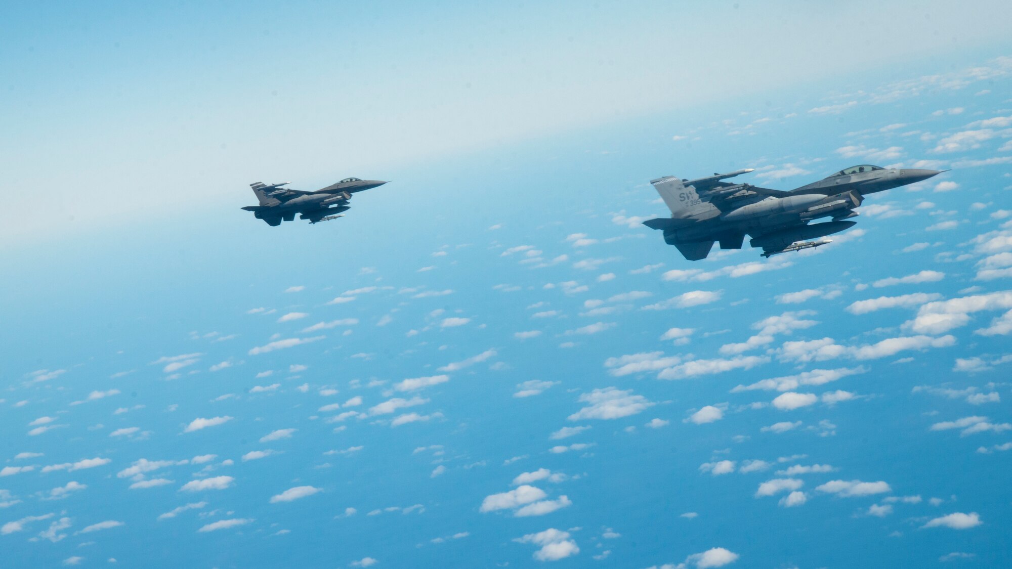 F-16 Fighting Falcon aircraft assigned to Shaw Air Force Base (AFB), South Carolina, fly in formation to receive air refueling support from a KC-135 Stratotanker aircraft assigned to MacDill AFB, Florida, Dec. 2, 2020.