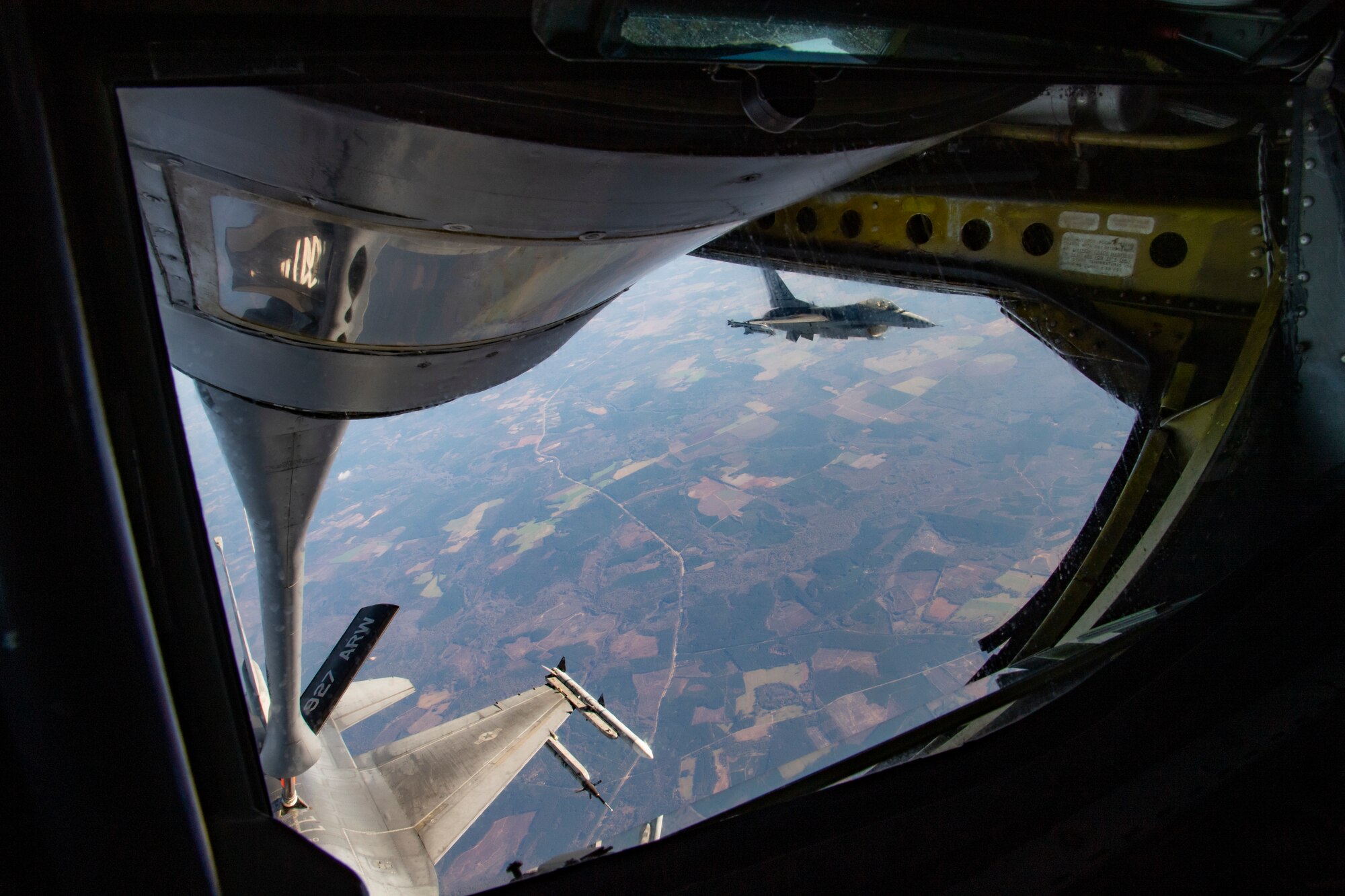 F-16 Fighting Falcon aircraft assigned to Shaw Air Force Base (AFB), South Carolina, fly in formation to receive air refueling support from a KC-135 Stratotanker aircraft assigned to MacDill AFB, Florida, Dec. 1, 2020.