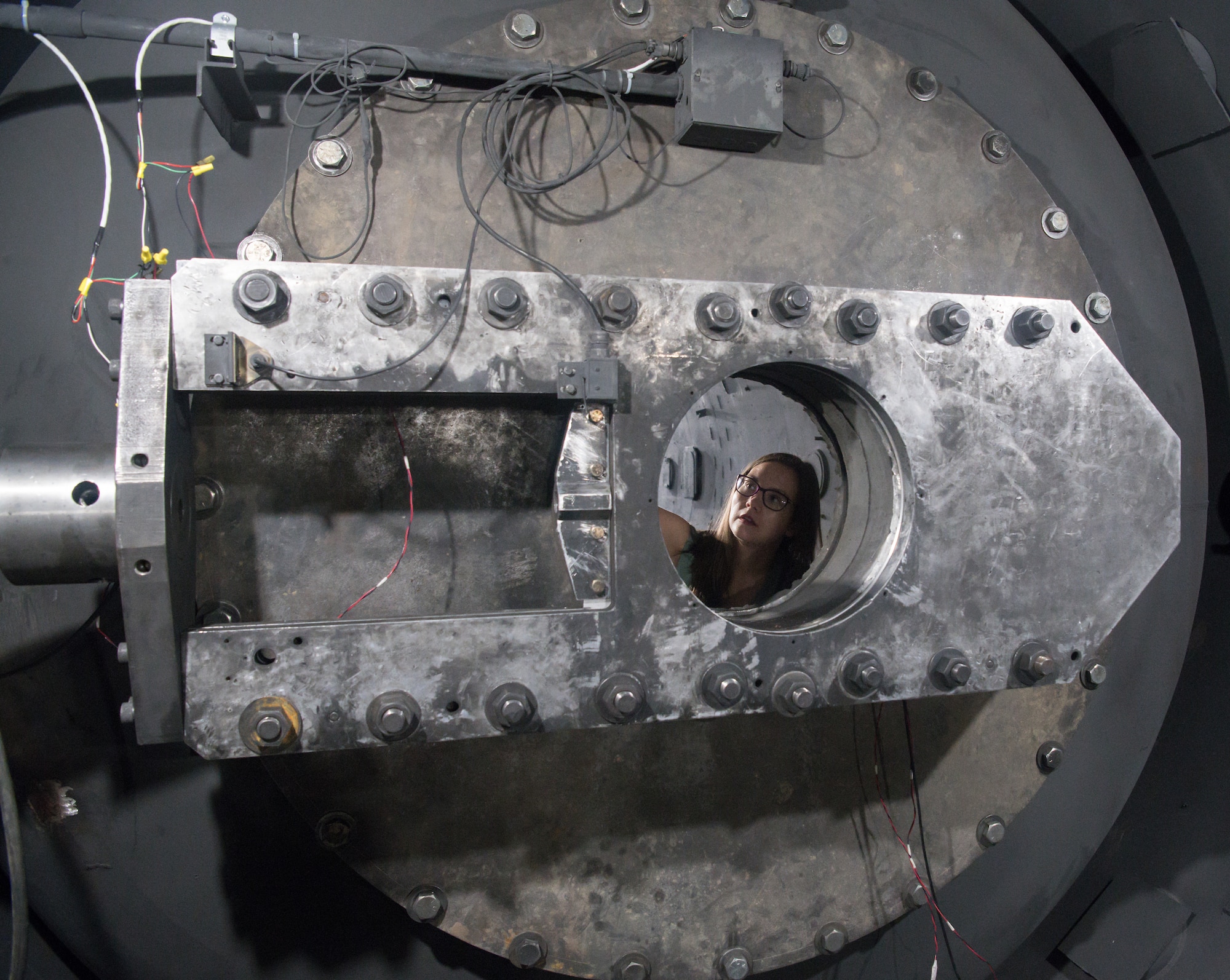 Bonni McKinney, test engineer for the Hypervelocity Flyout, Impact and Lethality Ground Test and Evaluation capability, inspects a quick-operating valve in Range G, July 21, 2020, at Arnold Air Force Base, Tenn. The range fires projectiles to simulate reentry, aerodynamics and high-speed impacts. (U.S. Air Force photo by Jill Pickett)