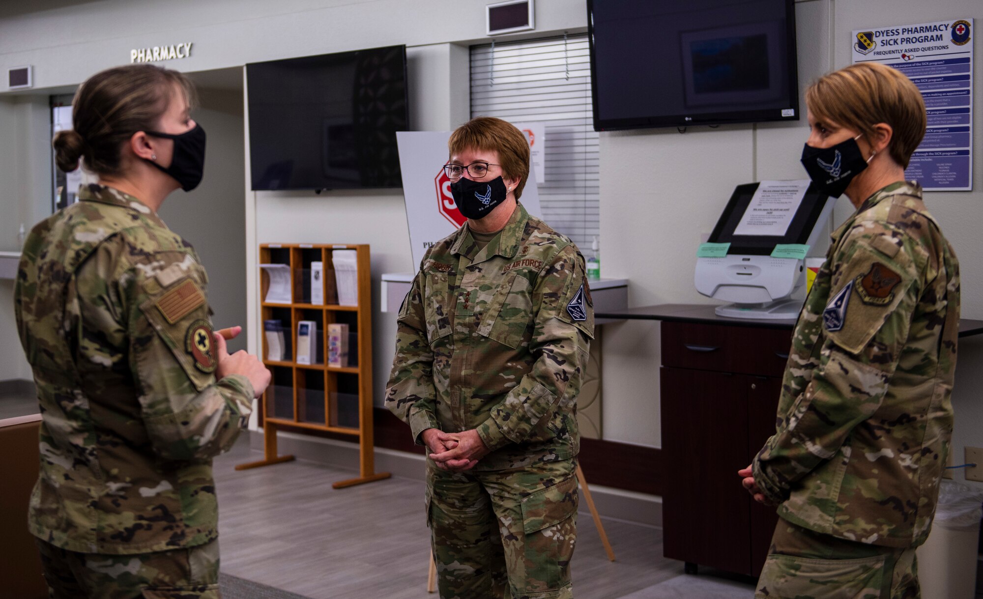 Maj. Miranda Smith, 7th Medical Support Squadron pharmacy flight commander, left, speaks with Lt. Gen. Dorothy Hogg, Air Force Surgeon General, middle, and Chief Master Sgt. Dawn Kolczynski, Chief, Medical Enlisted Force and Enlisted Corps Chief, about the pharmacy’s new COVID-19 procedures at Dyess Air Force Base, Texas, Dec. 3, 2020.